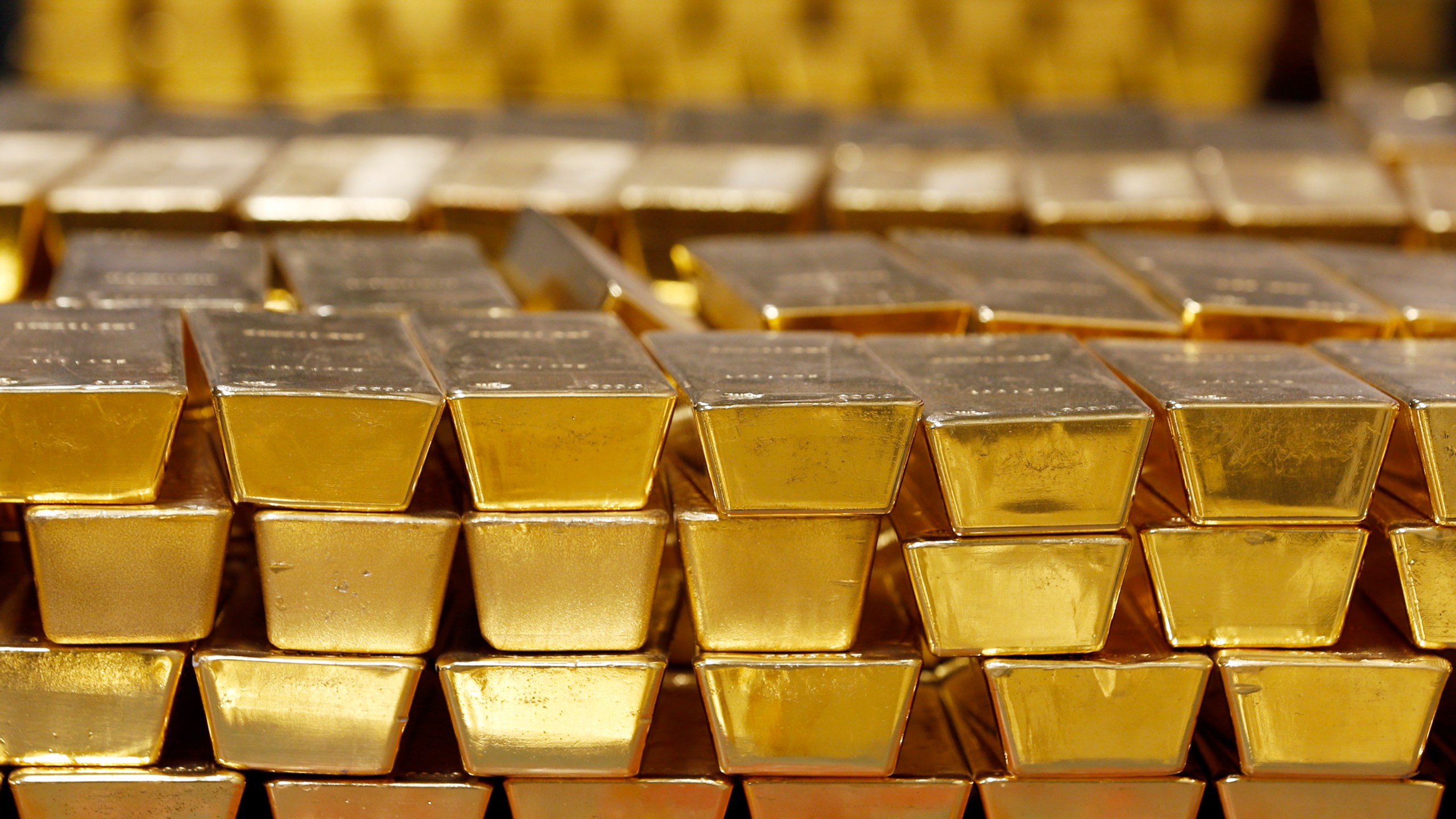 FILE - Gold bars are shown stacked in a vault at the United States Mint on July 22, 2014 in West Point, N.Y. (AP Photo/Mike Groll, File)