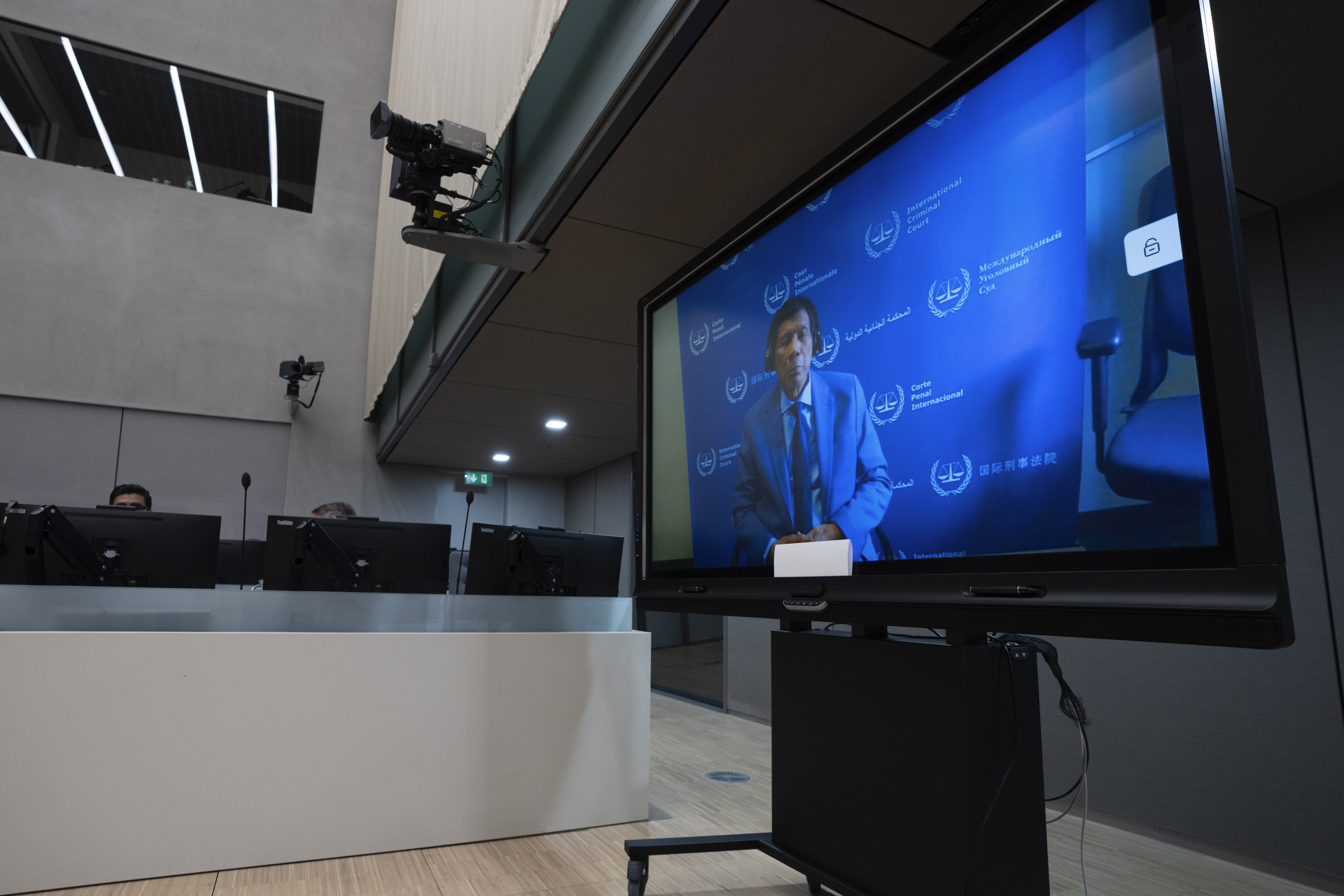 Former Philippine President Rodrigo Duterte is seen on a screen in the courtroom of the International Criminal Court (ICC) in The Hague, Netherlands, Friday, March 14, 2025. (AP Photo/Peter Dejong, Pool)