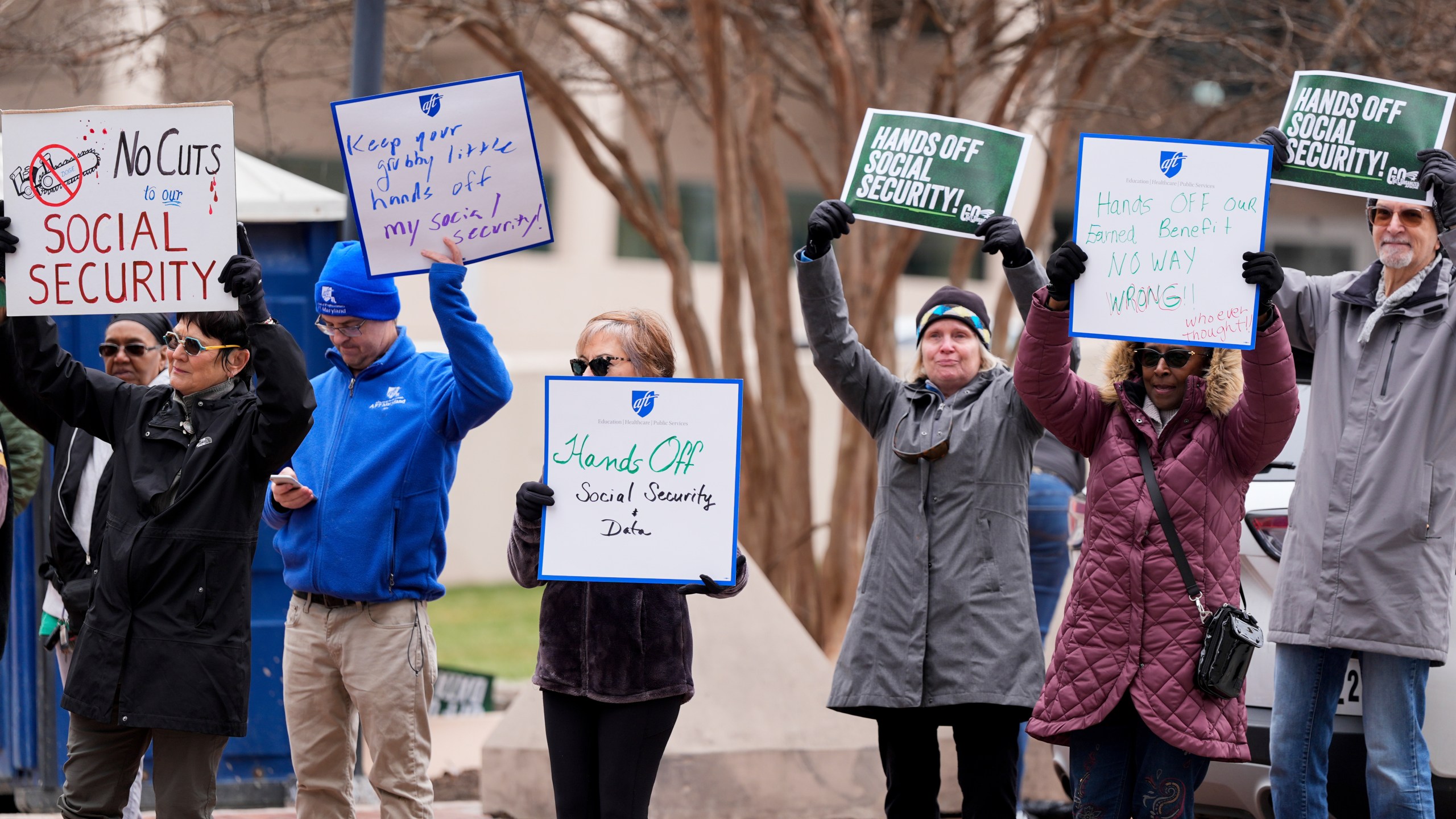 Demonstrators gather outside of the Edward A. Garmatz United States District Courthouse in Baltimore, on Friday, March 14, 2025, before a hearing regarding the Department of Government Efficiency's access to Social Security data. (AP Photo/Stephanie Scarbrough)