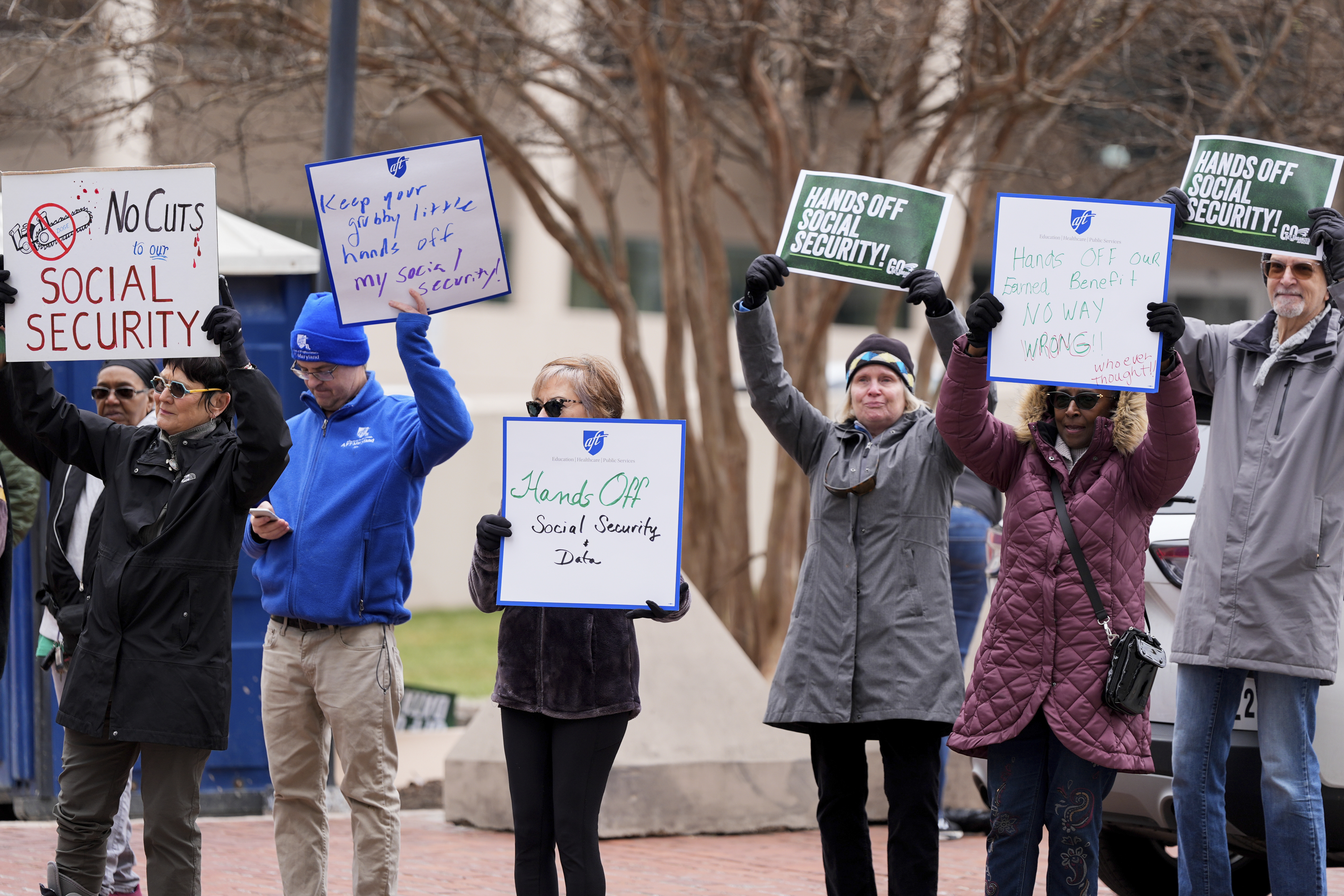 Demonstrators gather outside of the Edward A. Garmatz United States District Courthouse in Baltimore, on Friday, March 14, 2025, before a hearing regarding the Department of Government Efficiency's access to Social Security data. (AP Photo/Stephanie Scarbrough)