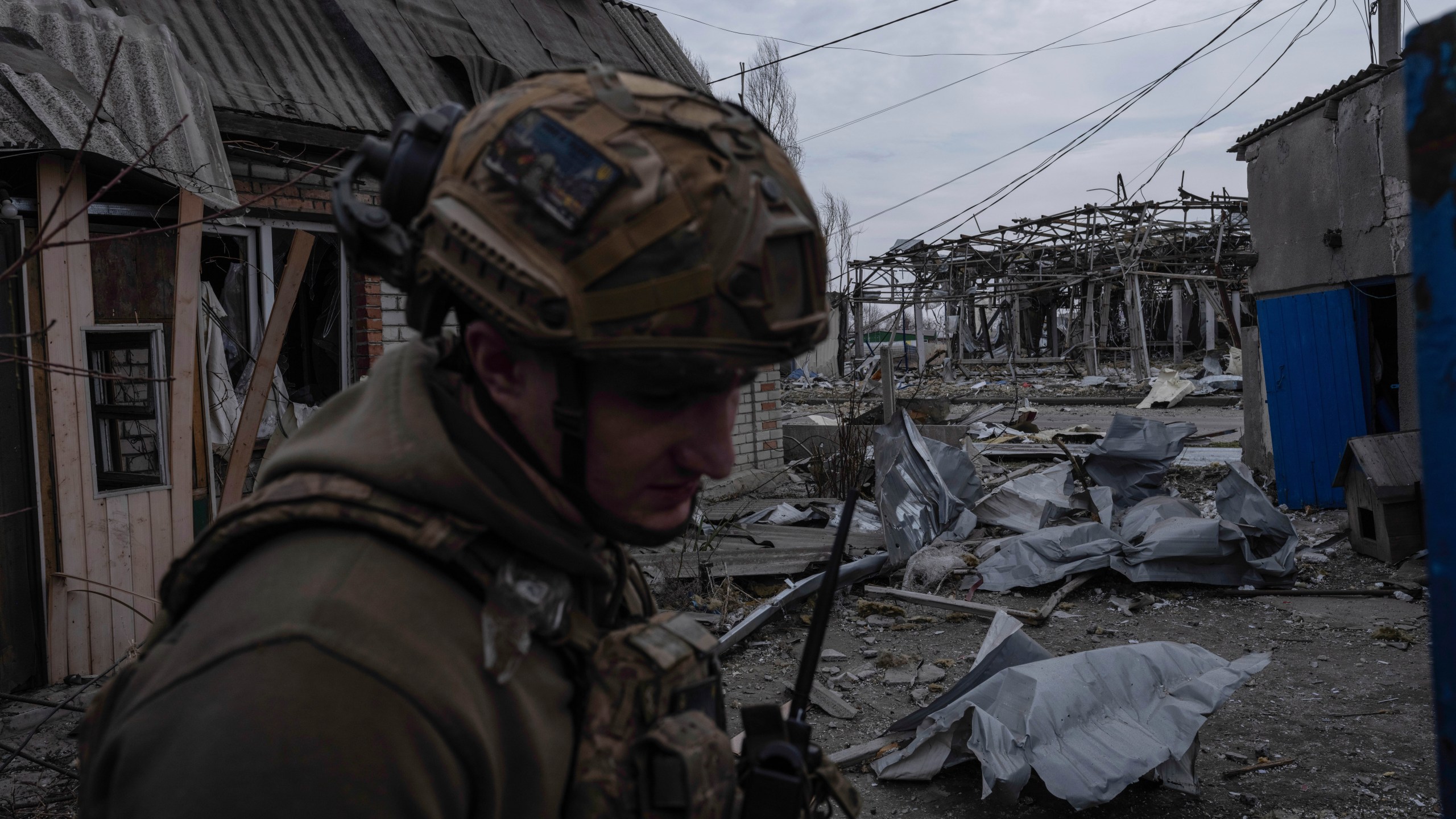 In this photo provided by Ukraine's 93rd Kholodnyi Yar Separate Mechanized Brigade press service, a soldier walks in Pokrovsk, the site of heavy battles with Russian troops, in the Donetsk region, Ukraine, Thursday, March 13, 2025. (Iryna Rybakova/Ukraine's 93rd Mechanized Brigade via AP)