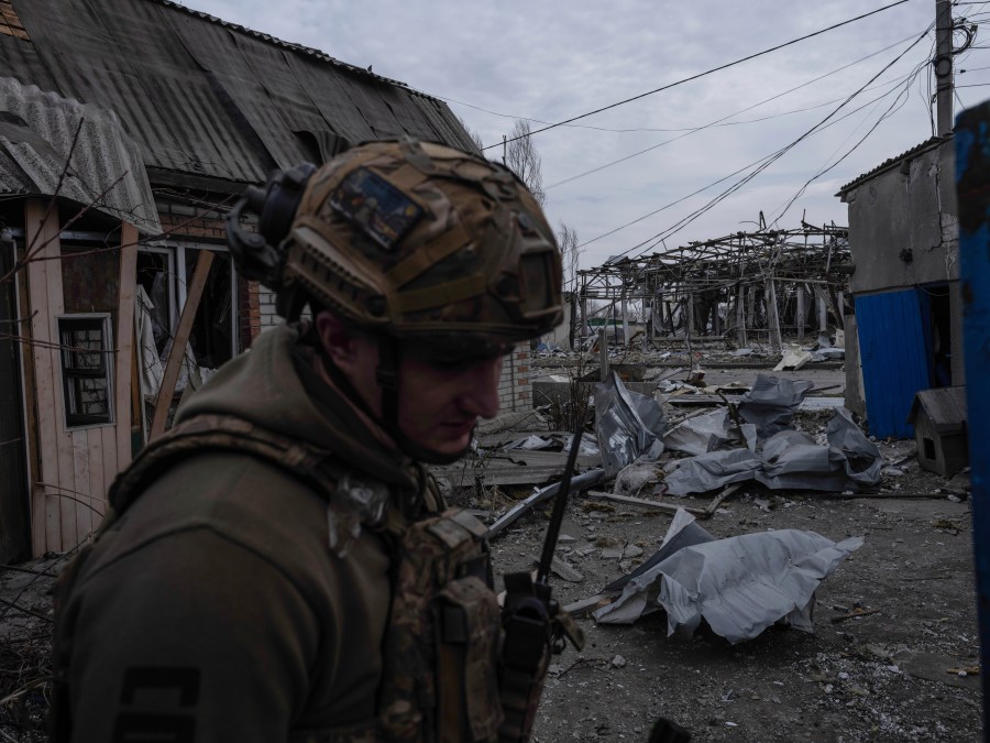 In this photo provided by Ukraine's 93rd Kholodnyi Yar Separate Mechanized Brigade press service, a soldier walks in Pokrovsk, the site of heavy battles with Russian troops, in the Donetsk region, Ukraine, Thursday, March 13, 2025. (Iryna Rybakova/Ukraine's 93rd Mechanized Brigade via AP)