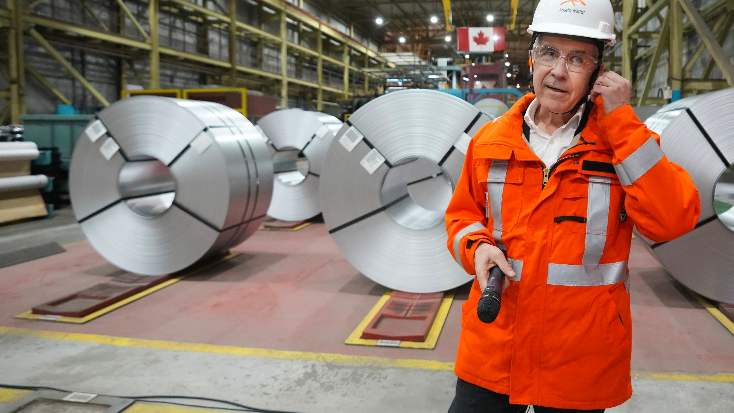 Canadian Prime Minister designate Mark Carney tours the ArcelorMittal Dofasco steel plant in Hamilton, Ontario, on Wednesday, March 12, 2025. (Nathan Denette/The Canadian Press via AP)