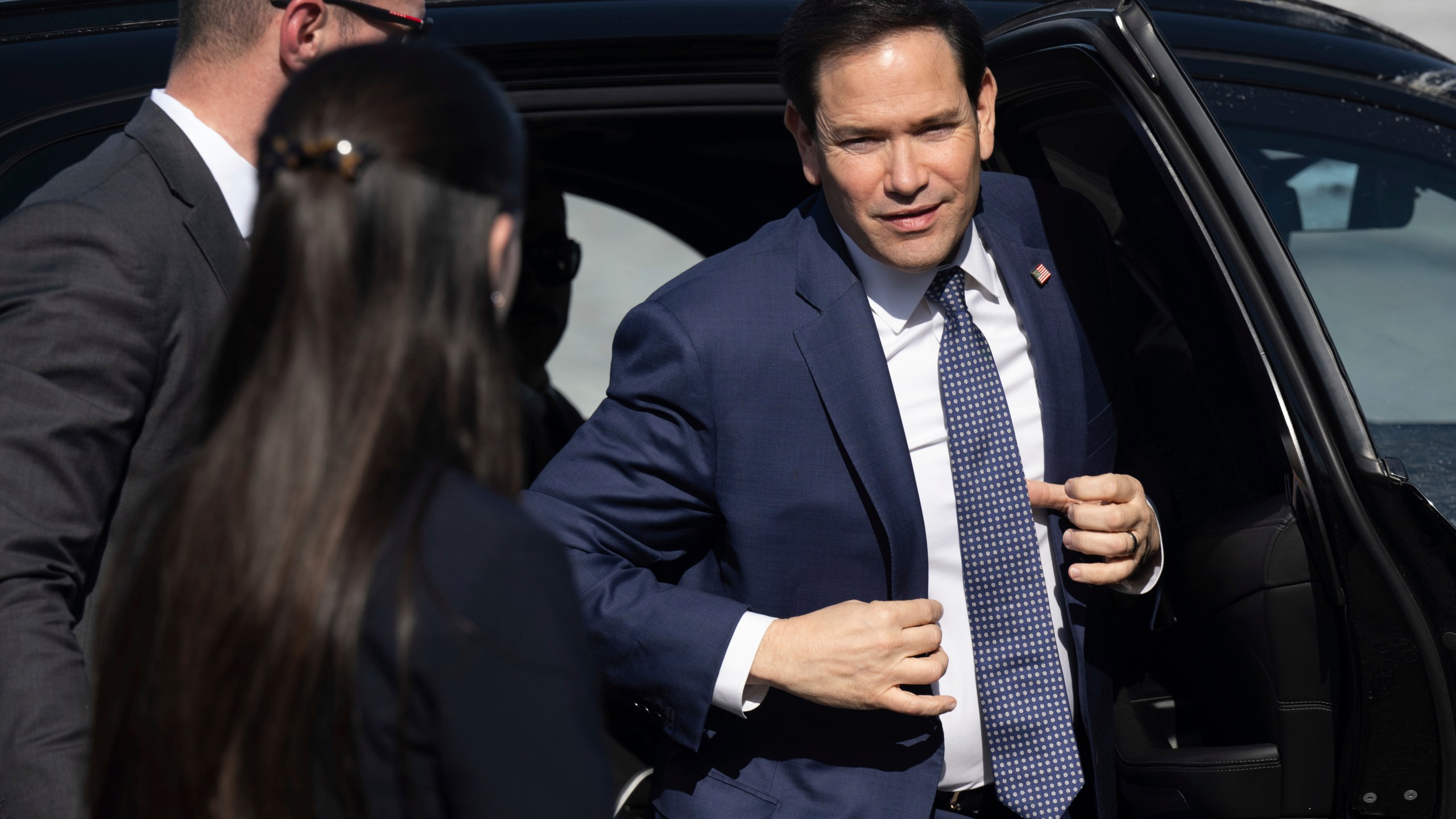 US Secretary of State Marco Rubio disembarks from his vehicle as he walks to board his airplane prior to departing Quebec City Jean Lesage International Airport in Quebec, Canada, Friday, March 14, 2025. (Saul Loeb, Pool Photo via AP)