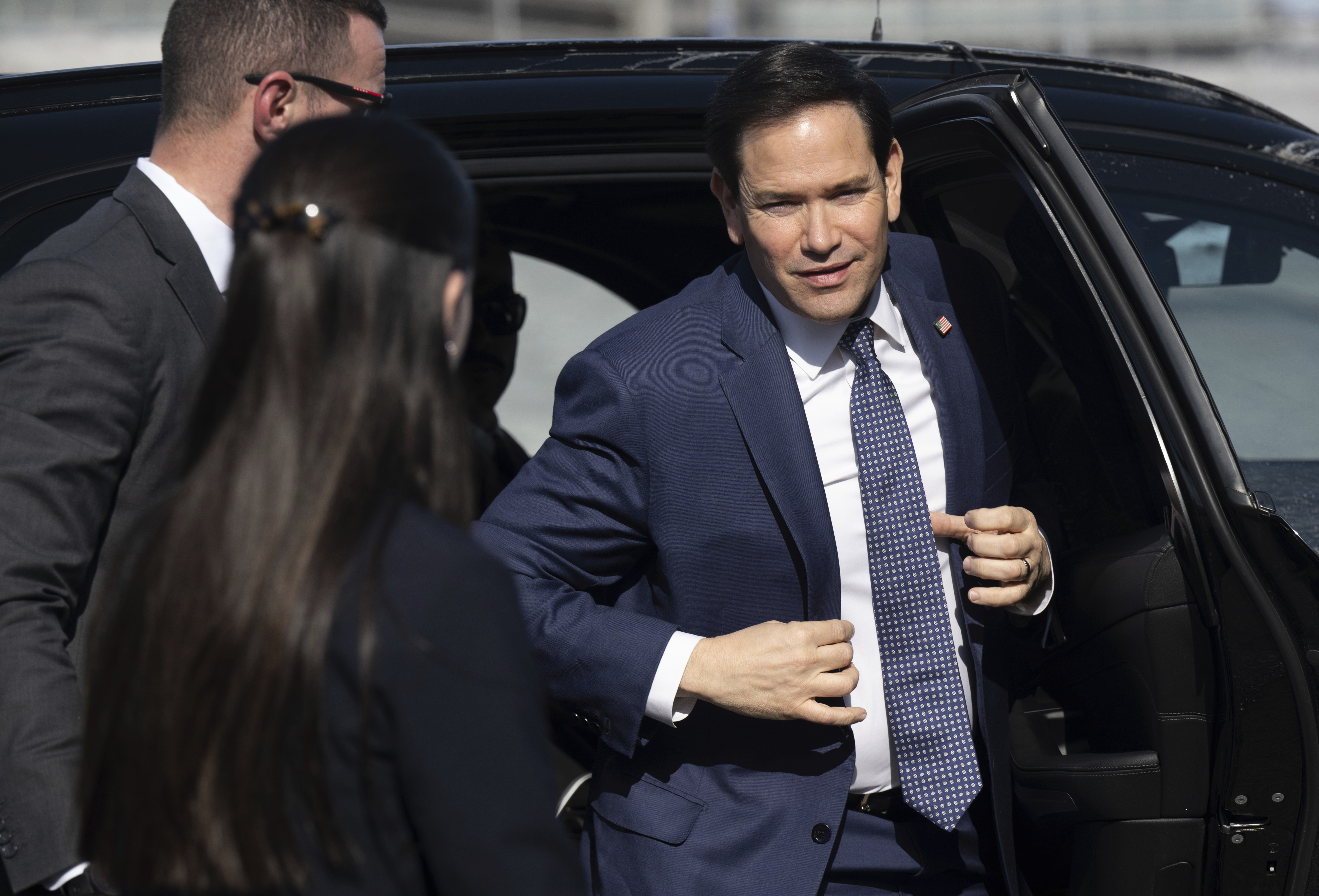 US Secretary of State Marco Rubio disembarks from his vehicle as he walks to board his airplane prior to departing Quebec City Jean Lesage International Airport in Quebec, Canada, Friday, March 14, 2025. (Saul Loeb, Pool Photo via AP)