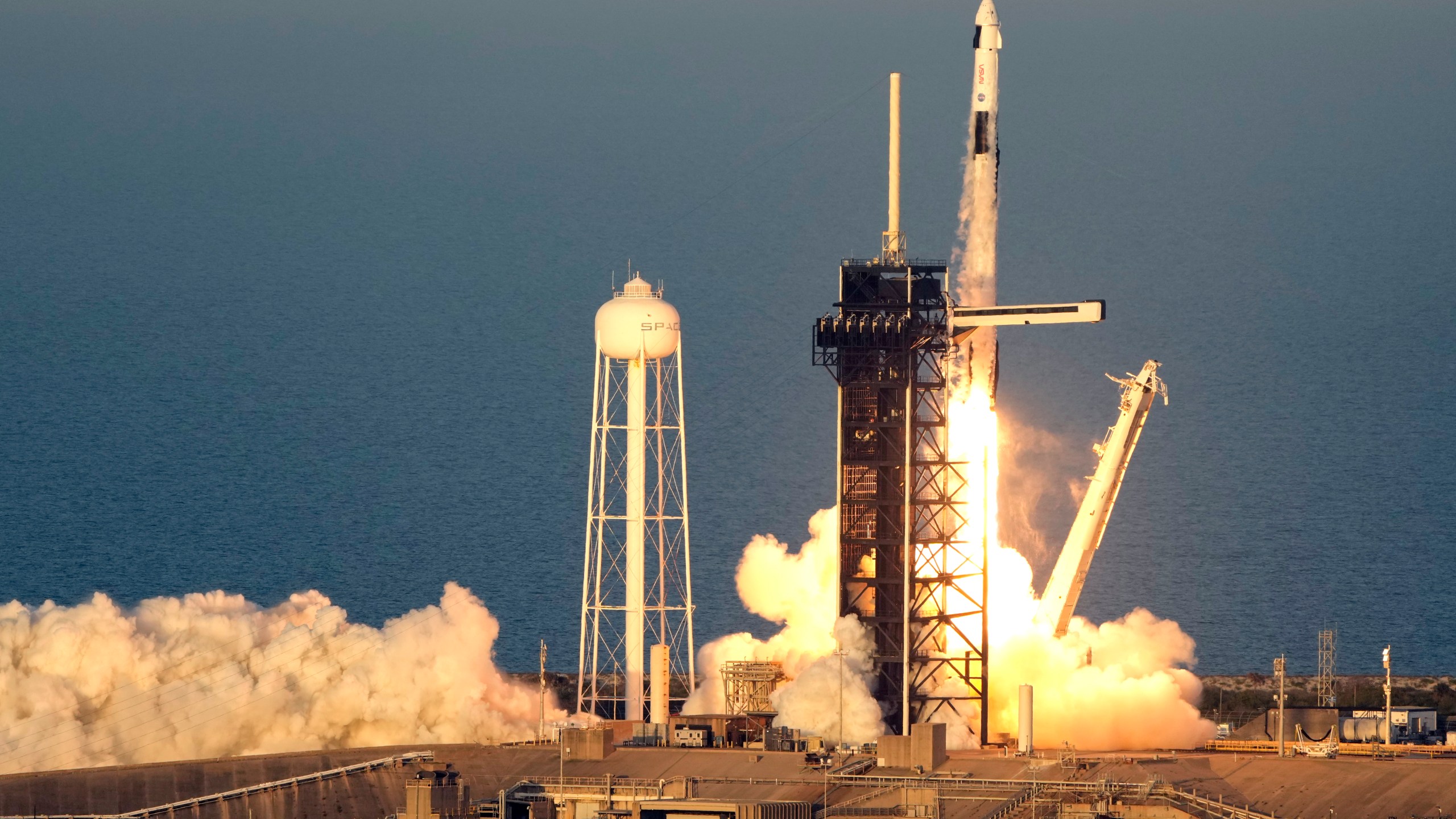 A SpaceX Falcon 9 rocket, with a crew of four aboard the Crew Dragon spacecraft, lifts off on a mission to the International Space Station lifts off from pad 39A at the Kennedy Space Center in Cape Canaveral, Fla., Friday, March 14, 2025. (AP Photo/John Raoux)