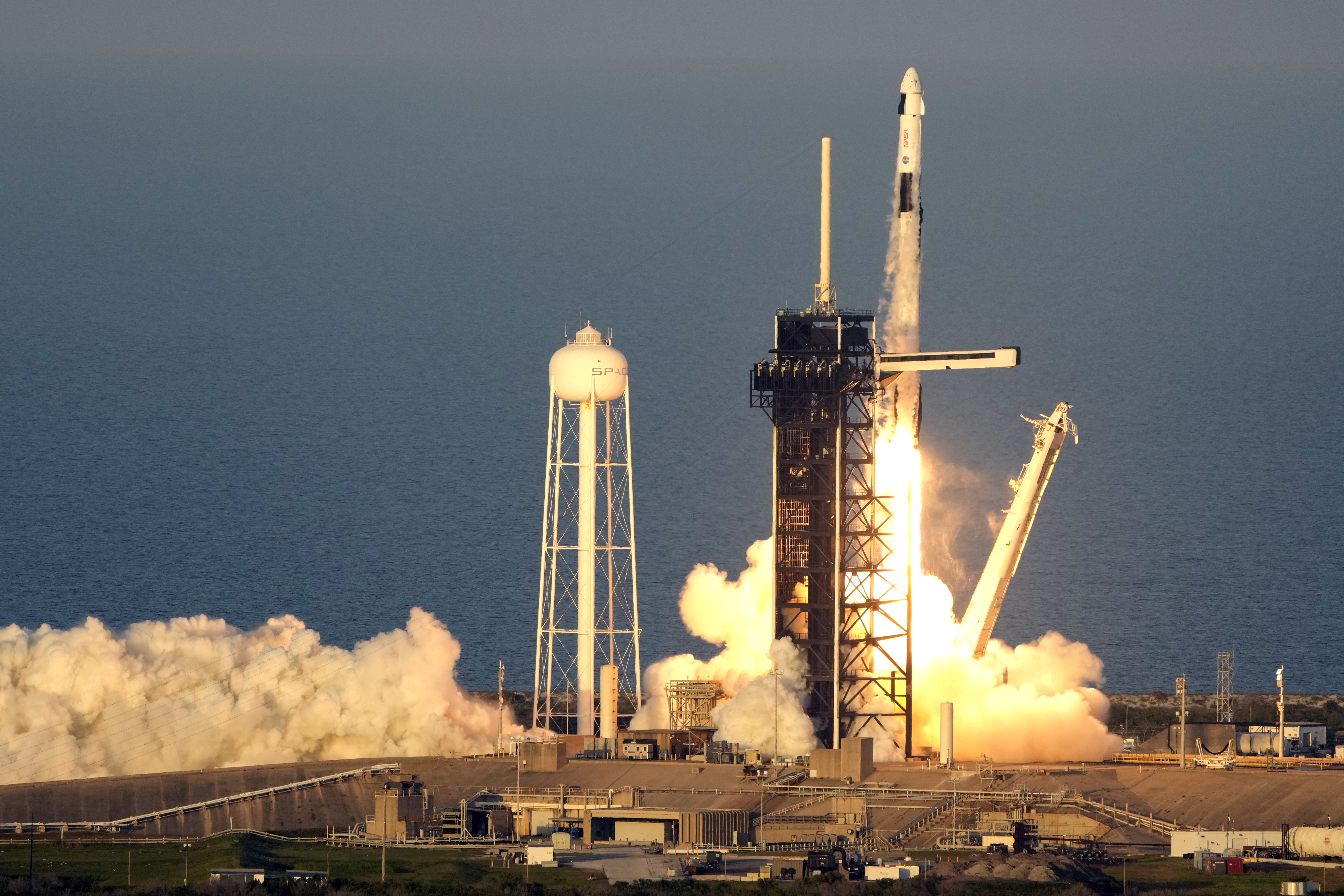 A SpaceX Falcon 9 rocket, with a crew of four aboard the Crew Dragon spacecraft, lifts off on a mission to the International Space Station lifts off from pad 39A at the Kennedy Space Center in Cape Canaveral, Fla., Friday, March 14, 2025. (AP Photo/John Raoux)