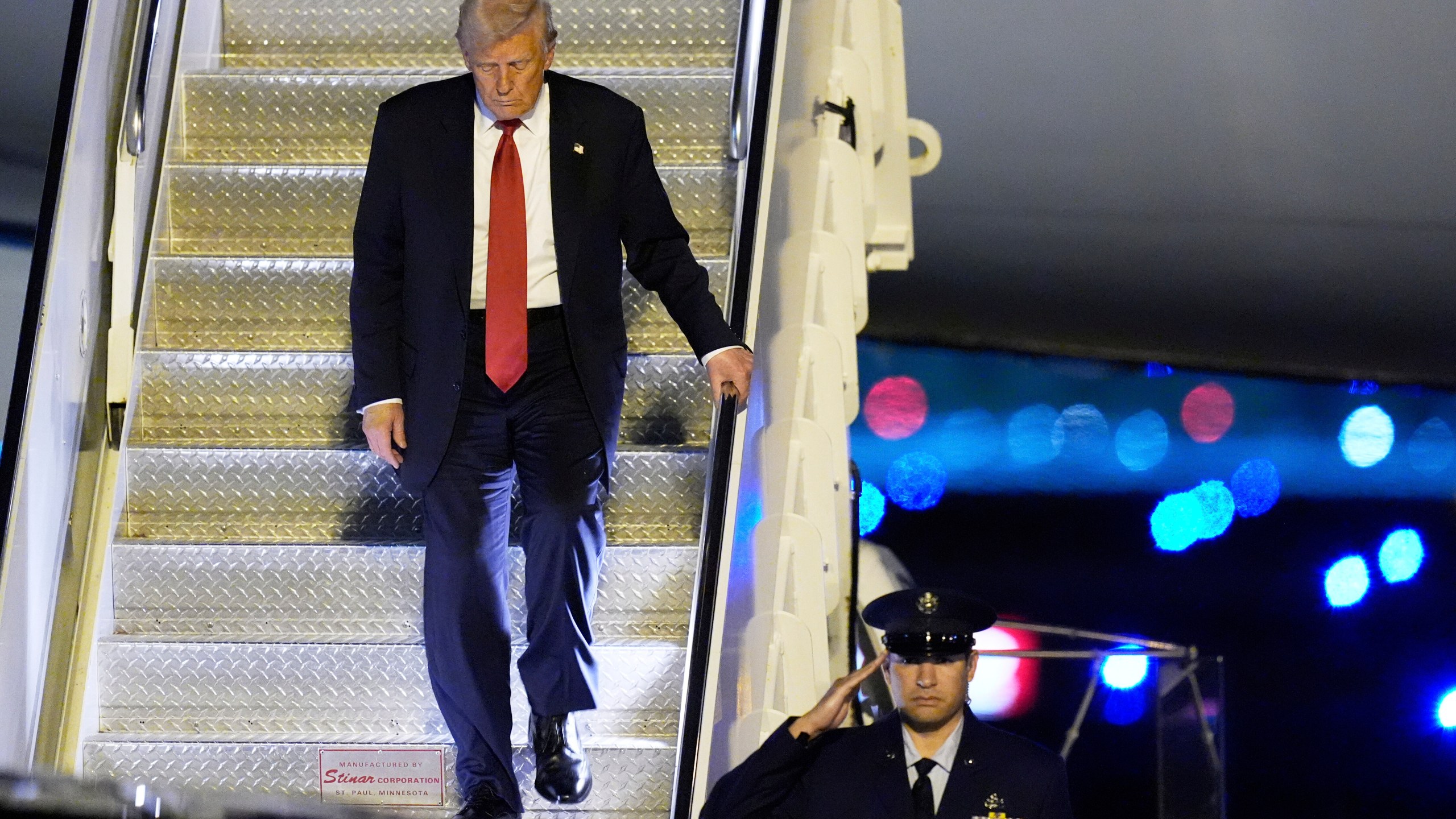 President Donald Trump arrives on Air Force One at Palm Beach International Airport, Friday, March 14, 2025, in West Palm Beach, Fla. (AP Photo/Manuel Balce Ceneta)