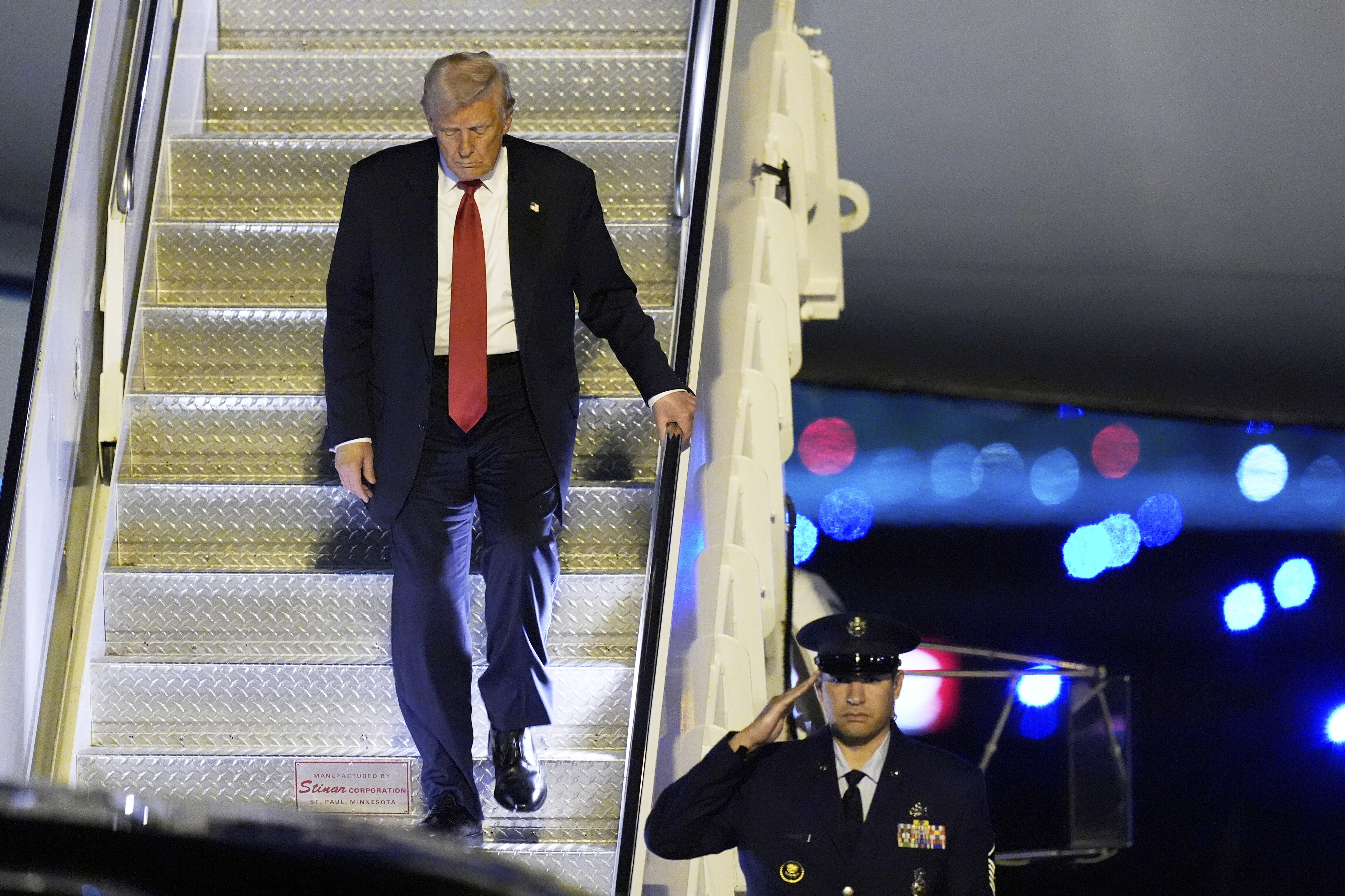 President Donald Trump arrives on Air Force One at Palm Beach International Airport, Friday, March 14, 2025, in West Palm Beach, Fla. (AP Photo/Manuel Balce Ceneta)