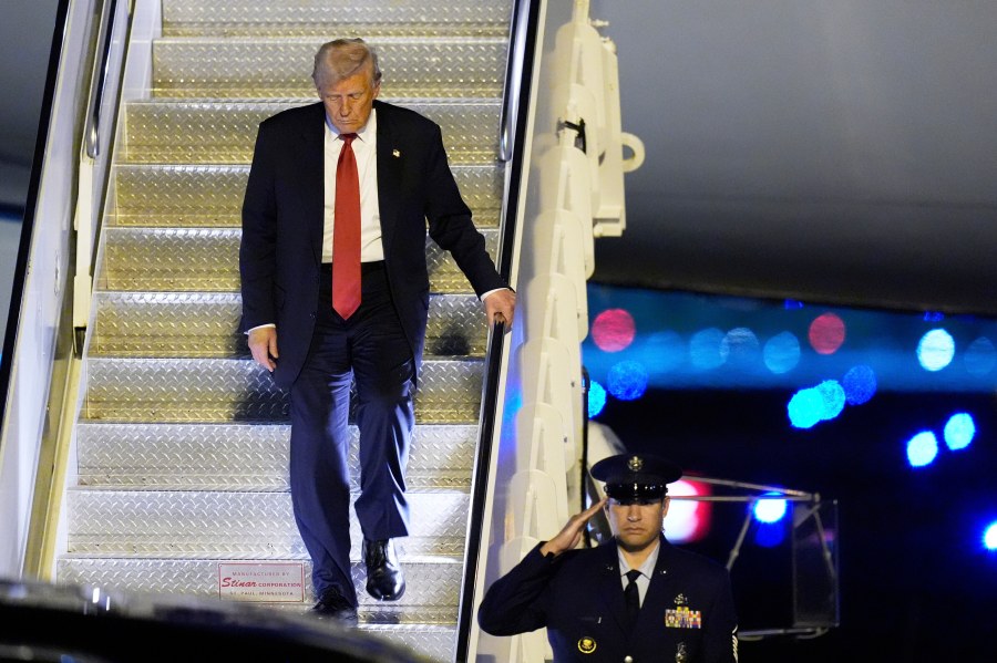 President Donald Trump arrives on Air Force One at Palm Beach International Airport, Friday, March 14, 2025, in West Palm Beach, Fla. (AP Photo/Manuel Balce Ceneta)