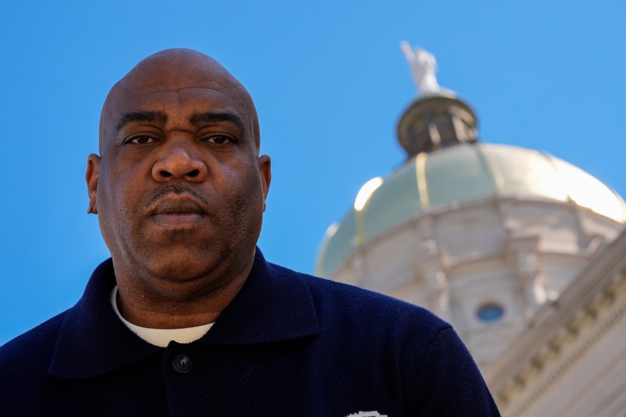 Michael Woolfolk poses for a photo at the state capitol, Thursday, March 6, 2025, in Atlanta. (AP Photo/Mike Stewart)