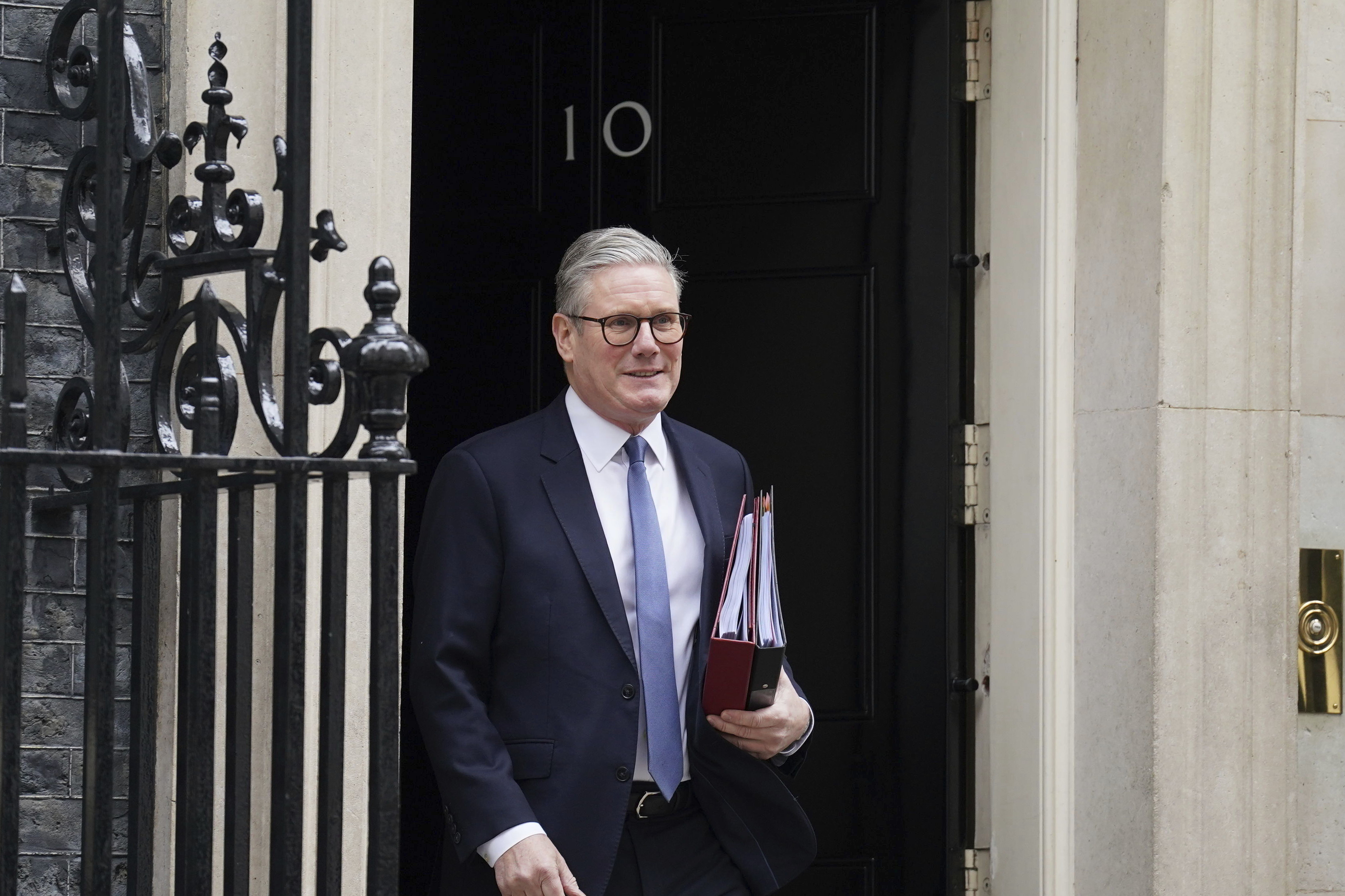 Prime Minister Sir Keir Starmer departs 10 Downing Street to attend Prime Minister's Questions at the Houses of Parliament in London, England, Wednesday, March 12, 2025. (Stefan Rousseau/PA via AP)