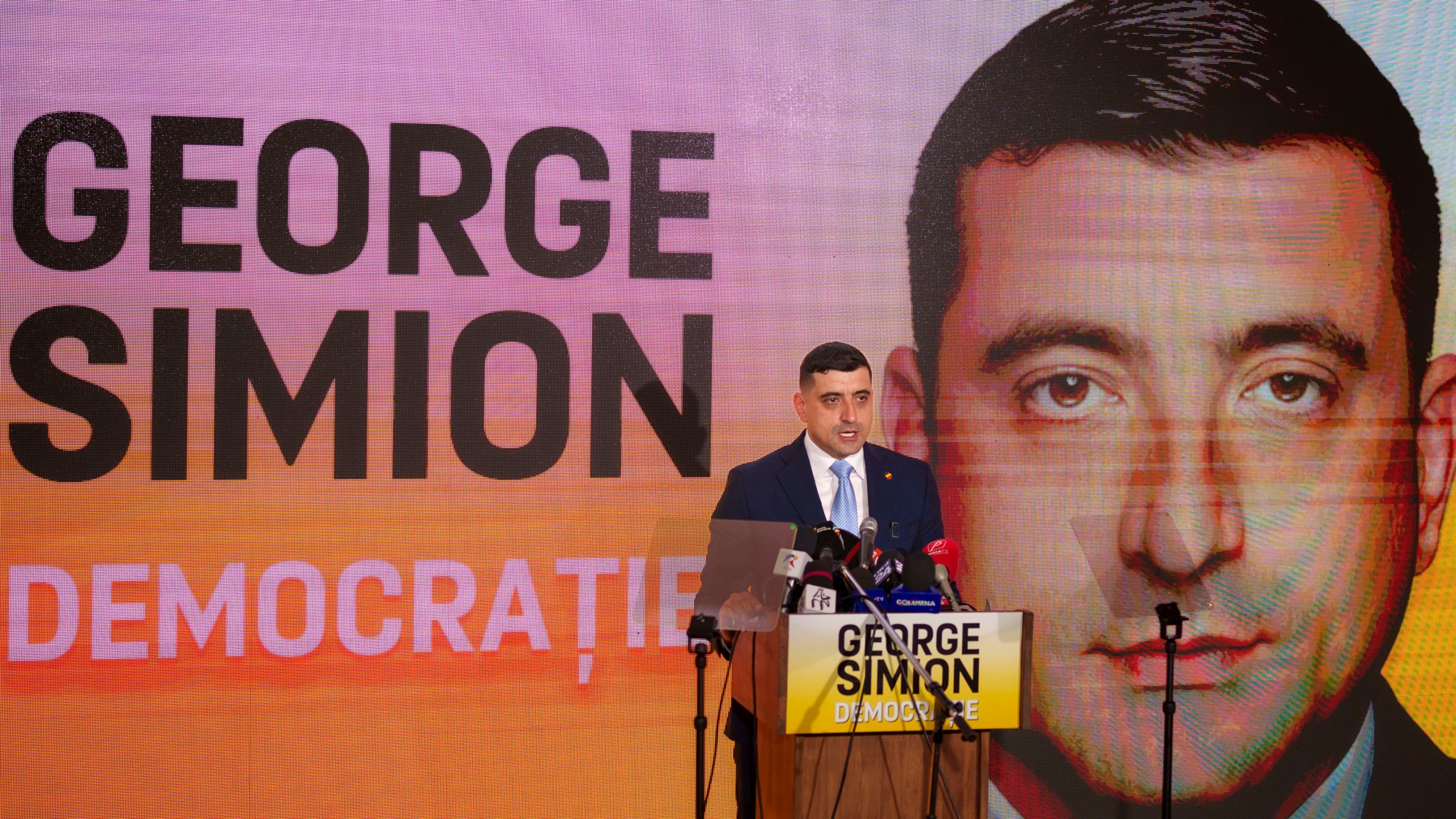 George Simion, the leader of Romania's most popular far-right party, the Alliance for the Union of Romanians (AUR), speaks in Bucharest, Romania, Friday, March 14, 2025, after filing his candidacy to participate in the country's presidential election rerun in May as he seeks to rally nationalist voters in the wake of last year's controversial frontrunner being barred from the race. (AP Photo/Vadim Ghirda)