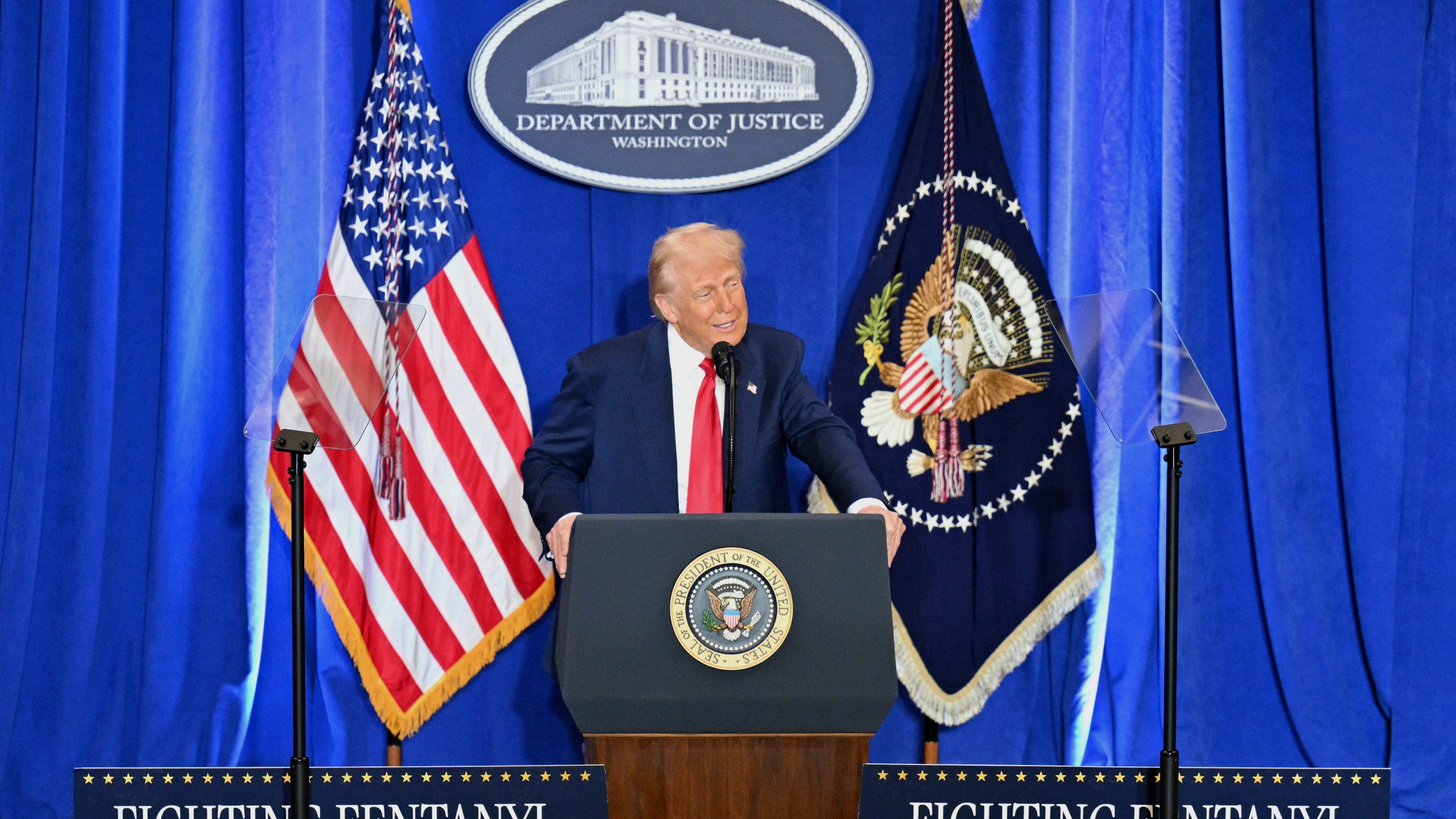 President Donald Trump speaks at the Justice Department in Washington, Friday, March 14, 2025. (Pool via AP)