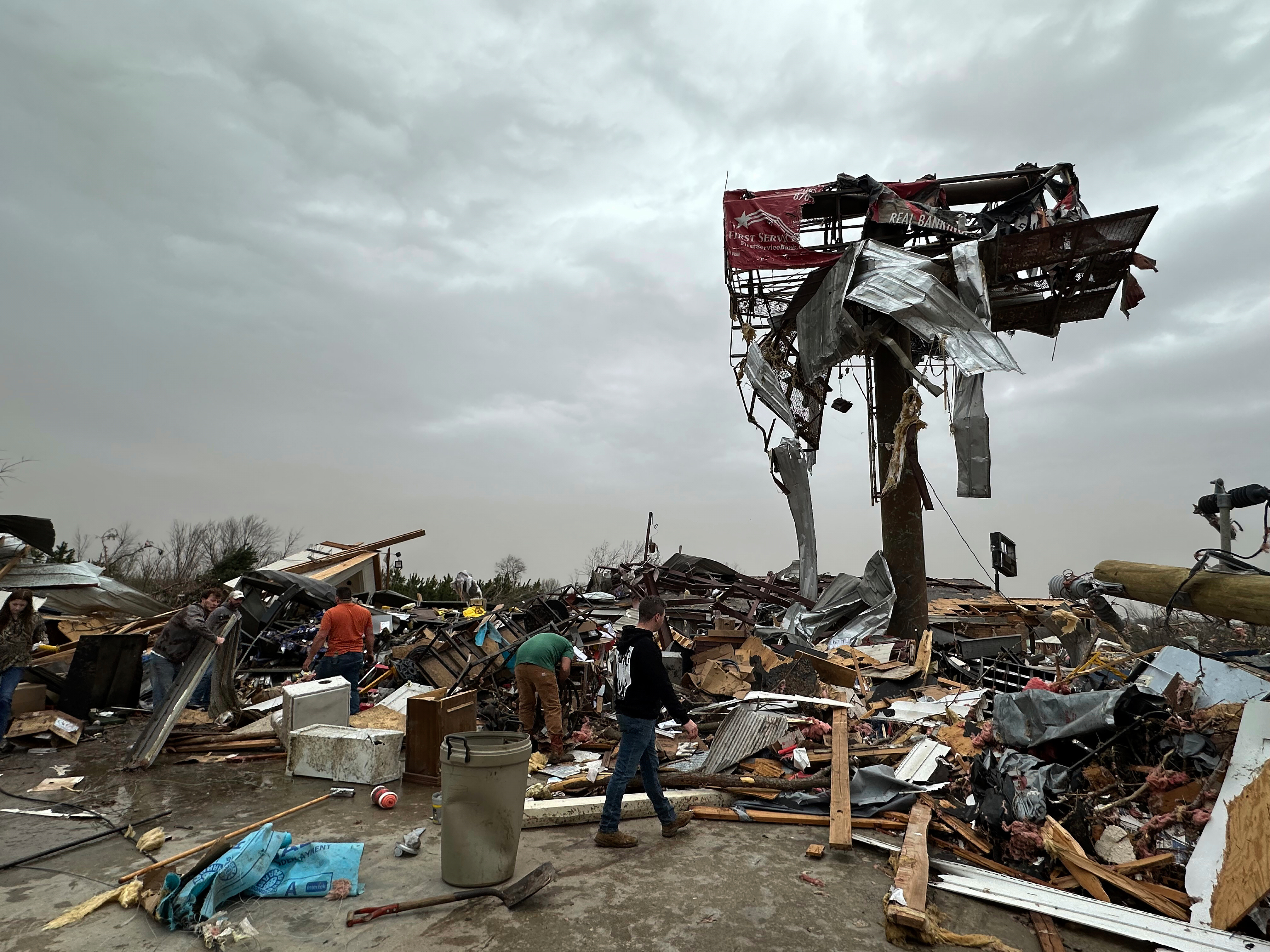 People work through the debris of the Cave City Auto Parts store on Saturday, March 15, 2025 after a severe weather storm Friday night in Cave City, Ark. (Staci Vandagriff/Arkansas Democrat-Gazette via AP)