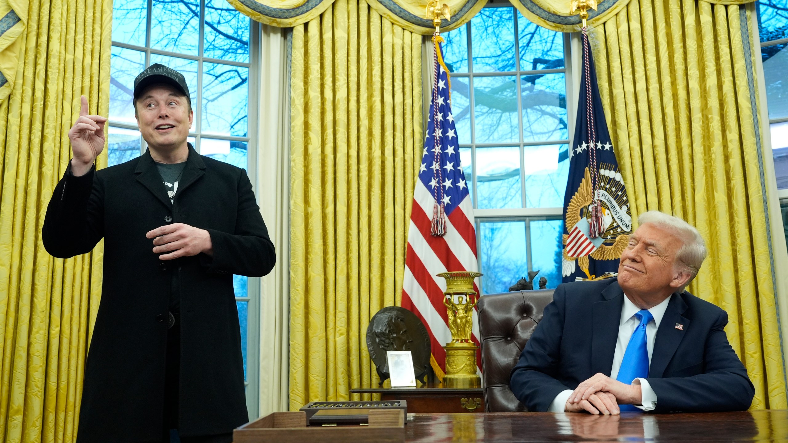 FILE - President Donald Trump listens as Elon Musk speaks in the Oval Office at the White House, Tuesday, Feb. 11, 2025, in Washington. (AP Photo/Alex Brandon, File)