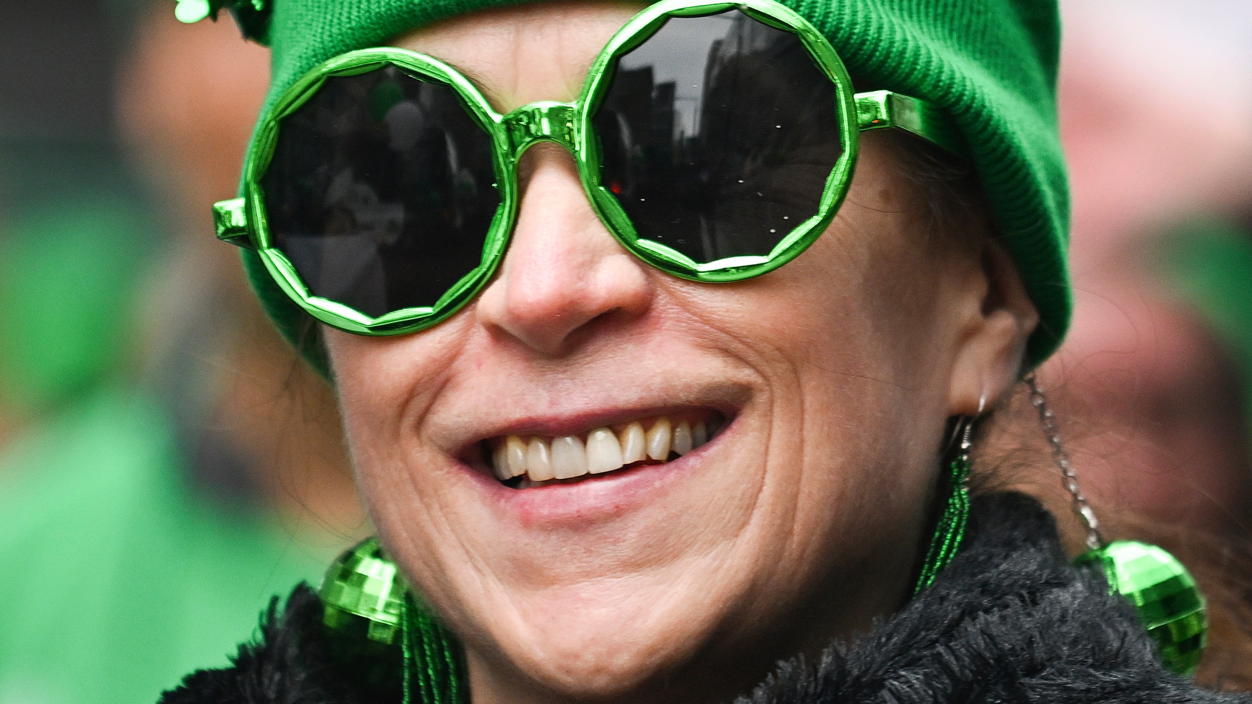 A participant smiles during the annual St. Patrick's Day Parade in Montreal, Sunday, March 16, 2025.(Graham Hughes /The Canadian Press via AP)