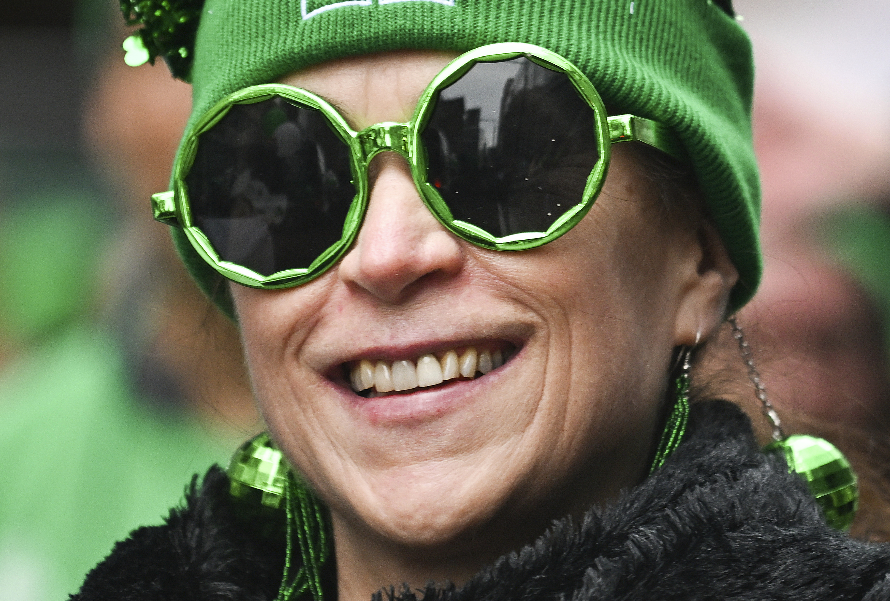 A participant smiles during the annual St. Patrick's Day Parade in Montreal, Sunday, March 16, 2025.(Graham Hughes /The Canadian Press via AP)