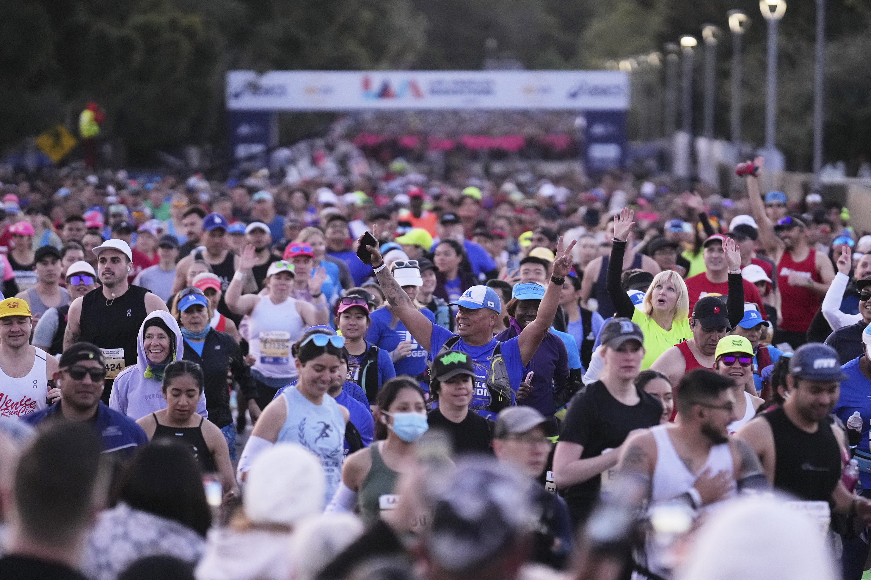 Participants prepare for the start of the Los Angeles Marathon Sunday, March 16, 2025, in Los Angeles. (AP Photo/Eric Thayer)