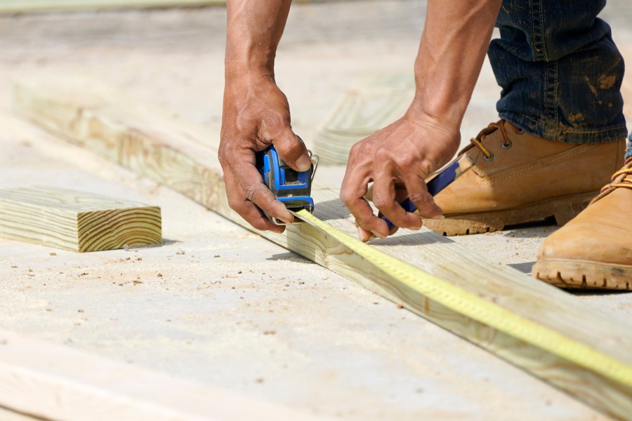 FILE - A beam is measured and marked at a housing site in Madison County, Miss., Tuesday, March 16, 2021. (AP Photo/Rogelio V. Solis, File)