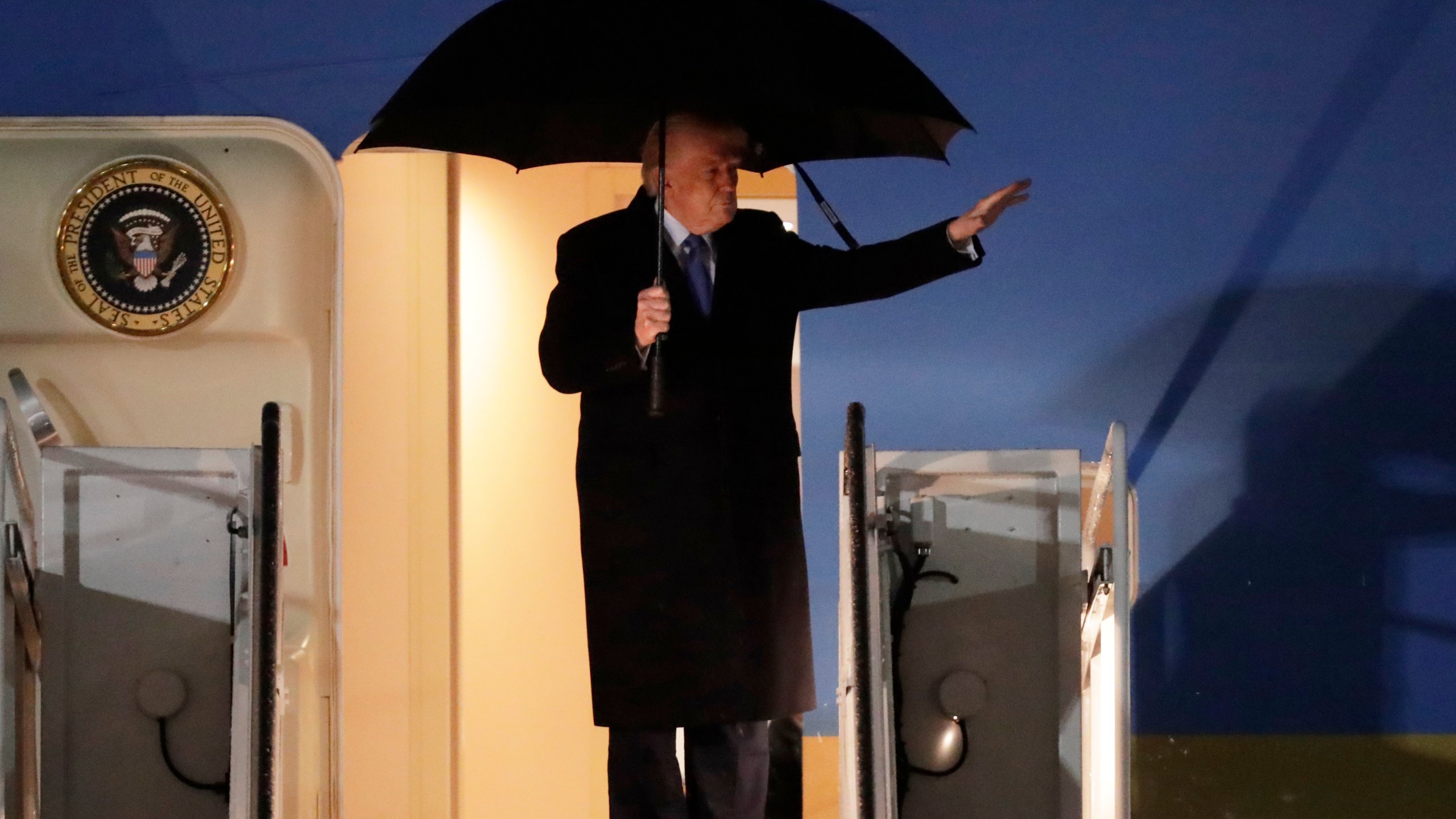 President Donald Trump waves from the stairs of Air Force One upon his arrival at Joint Base Andrews, Md., Monday, March 17, 2025 (AP Photo/Luis M. Alvarez)