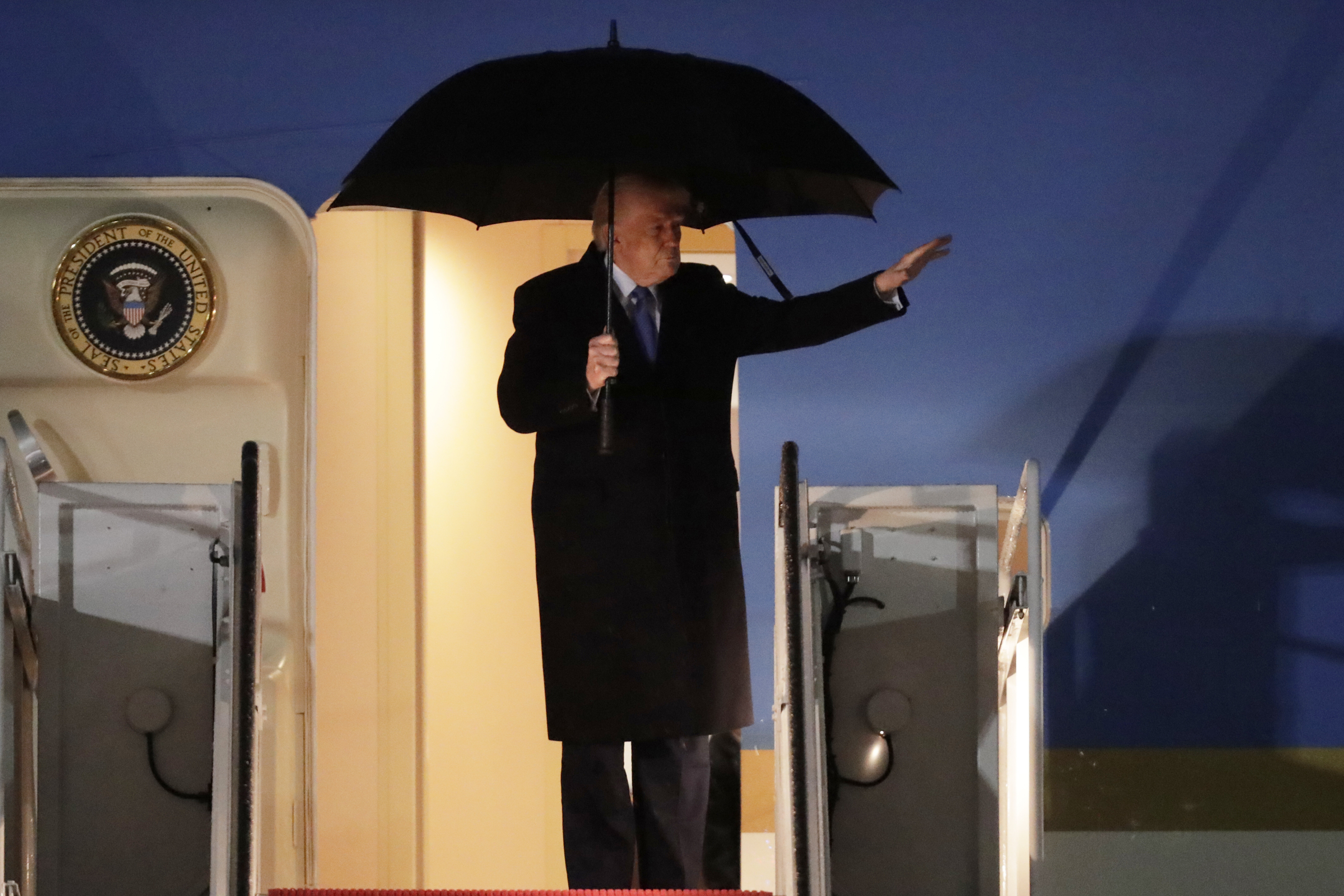 President Donald Trump waves from the stairs of Air Force One upon his arrival at Joint Base Andrews, Md., Monday, March 17, 2025 (AP Photo/Luis M. Alvarez)