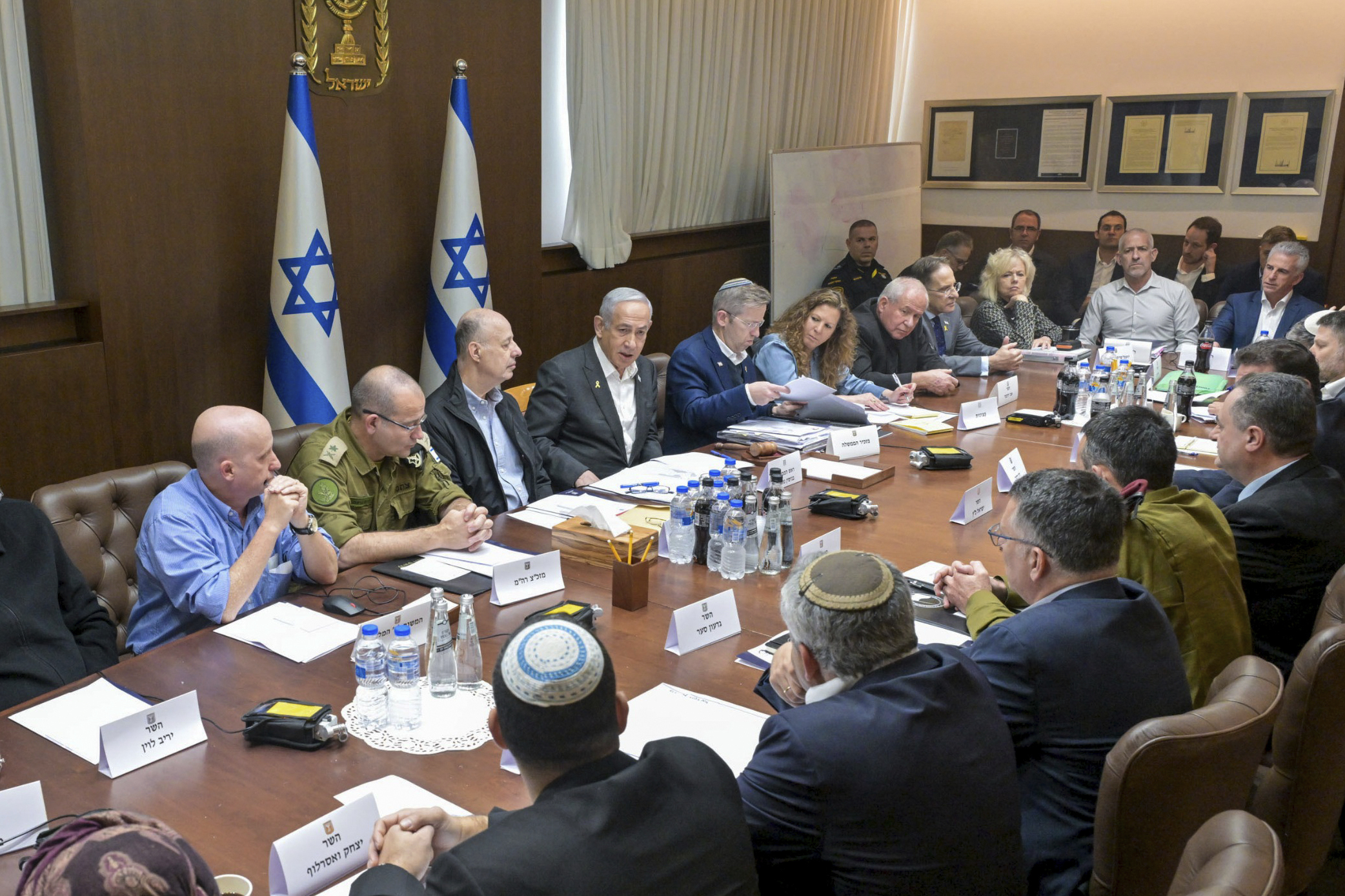 FILE - This photo provided by the Israeli Government Press Office, Israeli Prime Minister Benjamin Netanyahu, center, convenes his Security Cabinet to vote on a ceasefire deal with Hamas in Jerusalem, Jan. 17, 2025. (Koby Gideon/Israeli Government Press Office via AP, File)