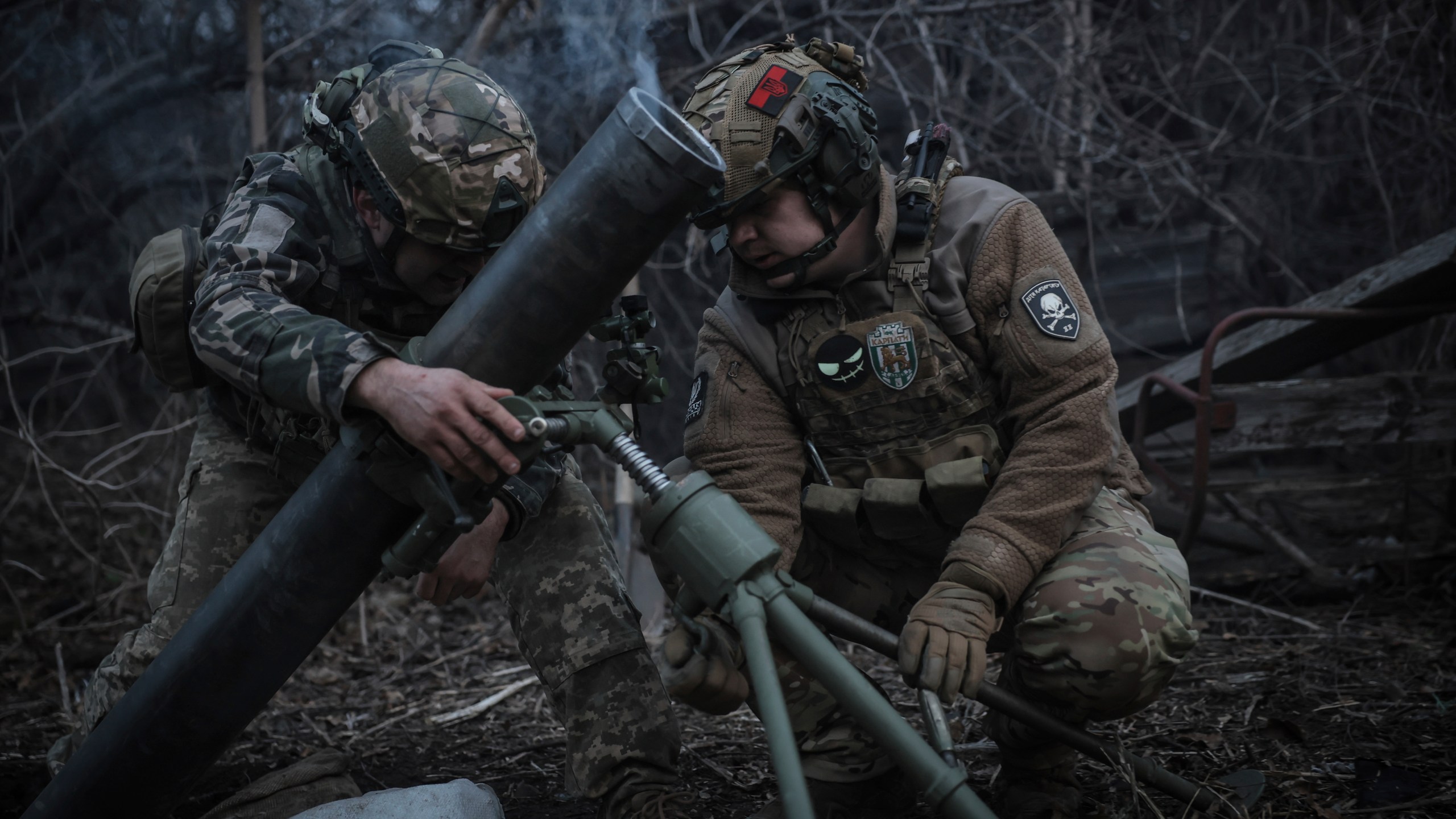 In this photo taken on March 16, 2025 and provided by Ukraine's 24th Mechanized Brigade press service, Ukrainian soldiers fire 120mm mortar towards Russian army positions near Chasiv Yar, Donetsk region, Ukraine, Sunday, March 16, 2025. (Oleg Petrasiuk/Ukraine's 24th Mechanized Brigade via AP)