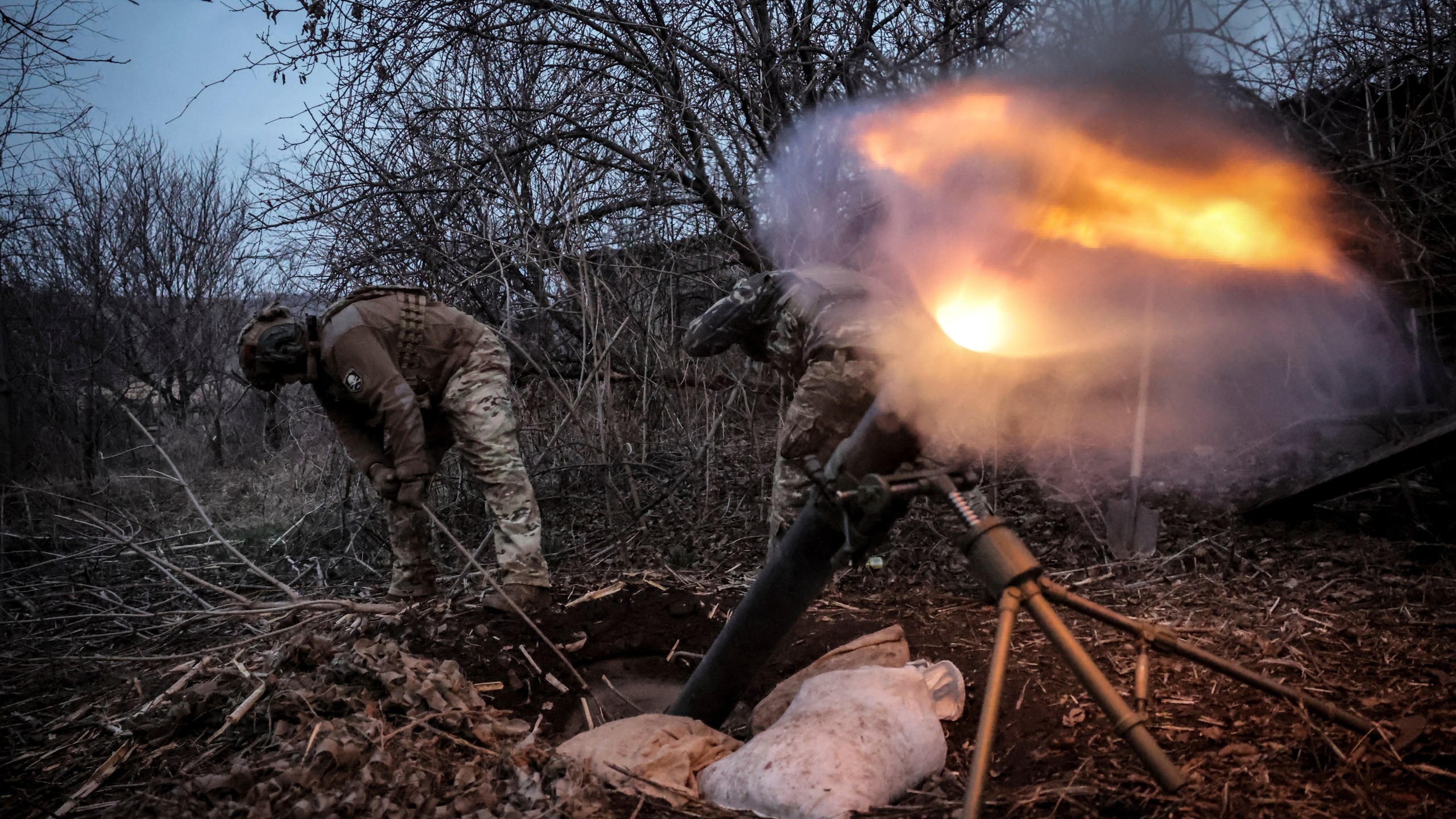 In this photo taken on March 16, 2025 and provided by Ukraine's 24th Mechanized Brigade press service, Ukrainian soldiers fire 120mm mortar towards Russian army positions near Chasiv Yar, Donetsk region, Ukraine, Sunday, March 16, 2025. (Oleg Petrasiuk/Ukraine's 24th Mechanized Brigade via AP)