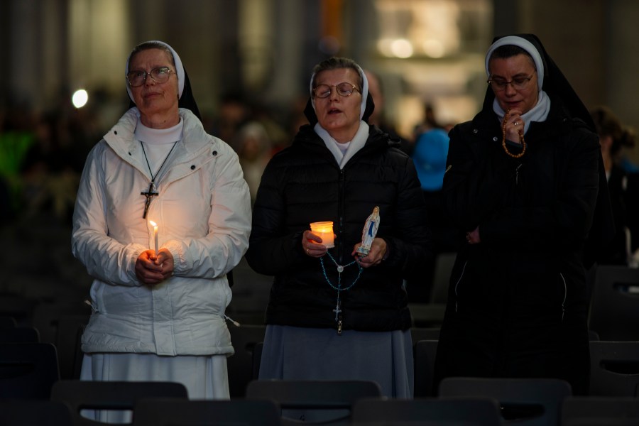 Nuns pray the rosary in St. Peter's Square at The Vatican, Sunday, Mar. 16, 2025, for the health of Pope Francis hospitalized at Agostino Gemelli Polyclinic in Rome where he is being treated for bilateral pneumonia since Feb.14. (AP Photo/Domenico Stinellis)