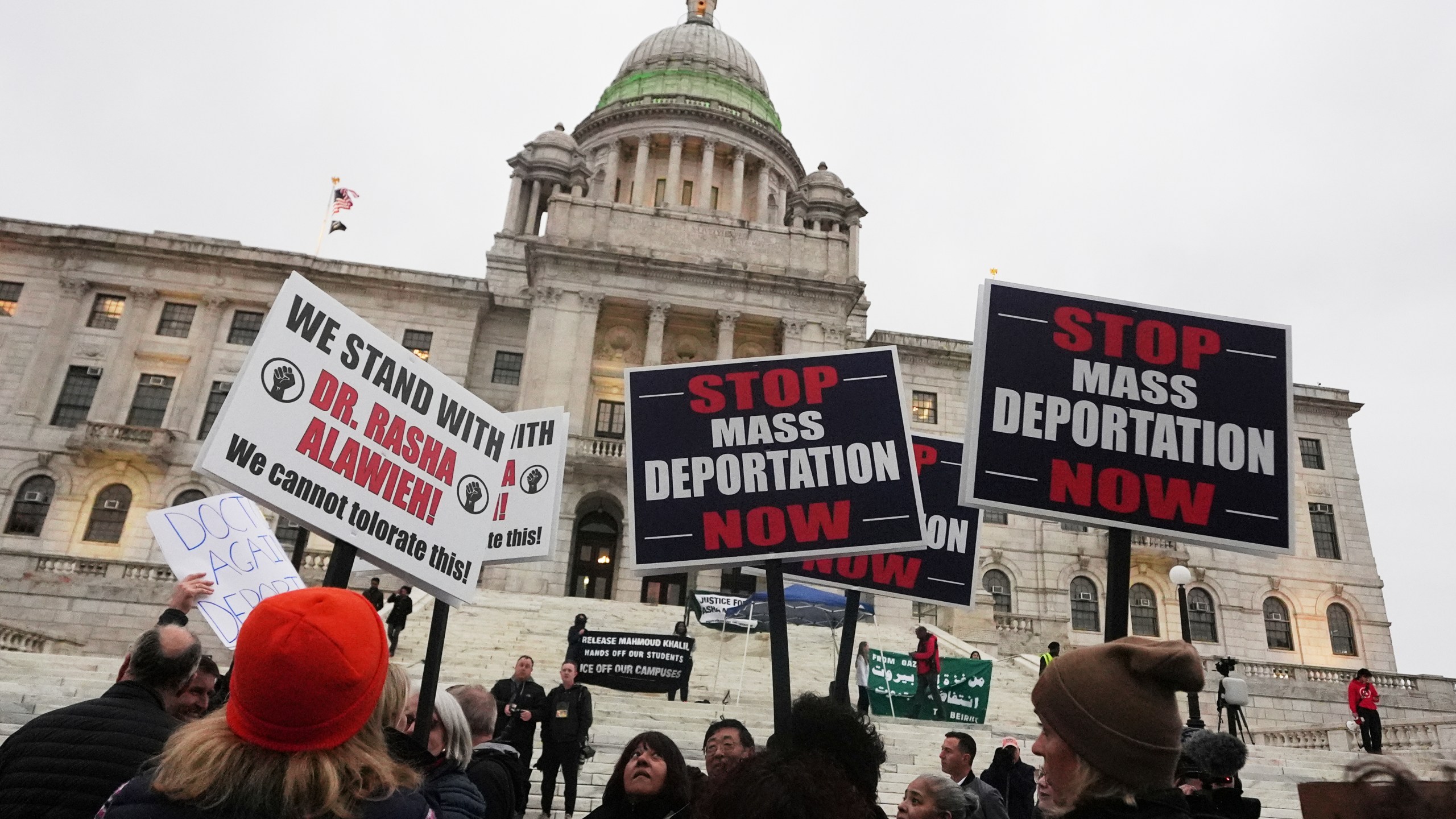 Protesters rally outside the Rhode Island State House in support of deported Brown University Dr. Rasha Alawieh, Monday, March 17, 2025, in Providence, R.I. (AP Photo/Charles Krupa)