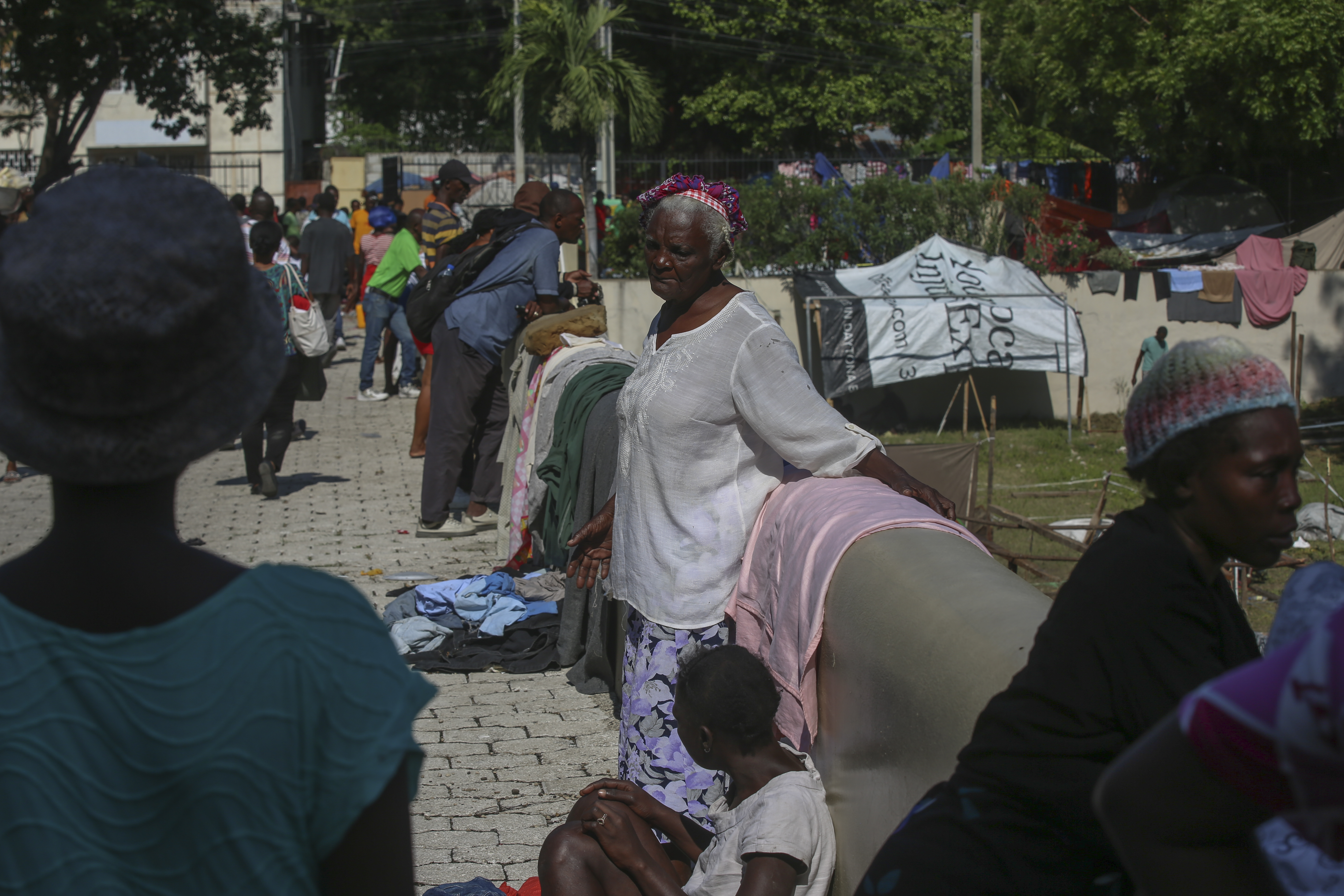 People displaced by gang violence take refuge at a Mormon church converted into a shelter in Port-au-Prince, Haiti, Friday, March 14, 2025. (AP Photo/Odelyn Joseph)