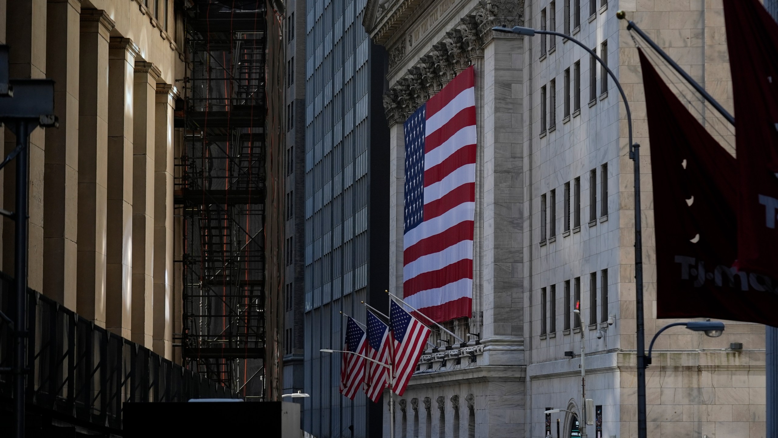 An American flag is displayed on the outside of the New York Stock Exchange in New York, Wednesday, Feb. 26, 2025. (AP Photo/Seth Wenig)