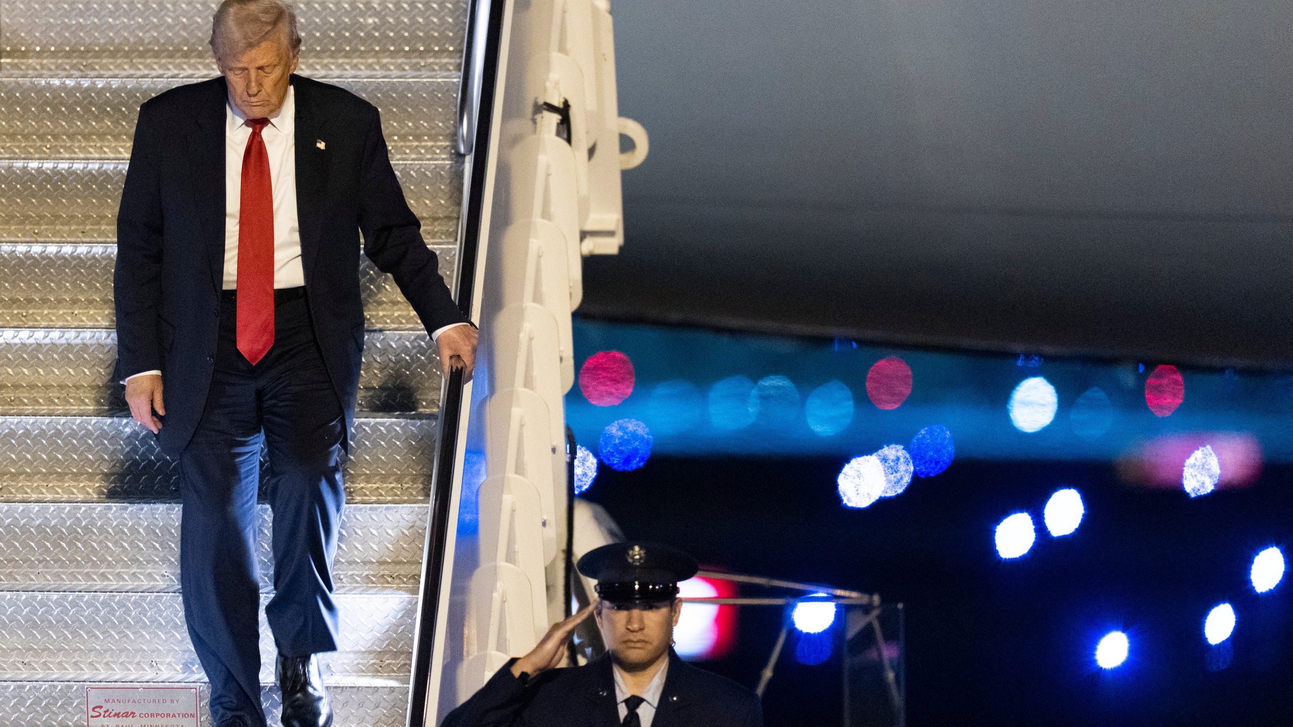 President Donald Trump arrives on Air Force One at Palm Beach International Airport, Friday, March 14, 2025, in West Palm Beach, Fla. (AP Photo/Manuel Balce Ceneta)