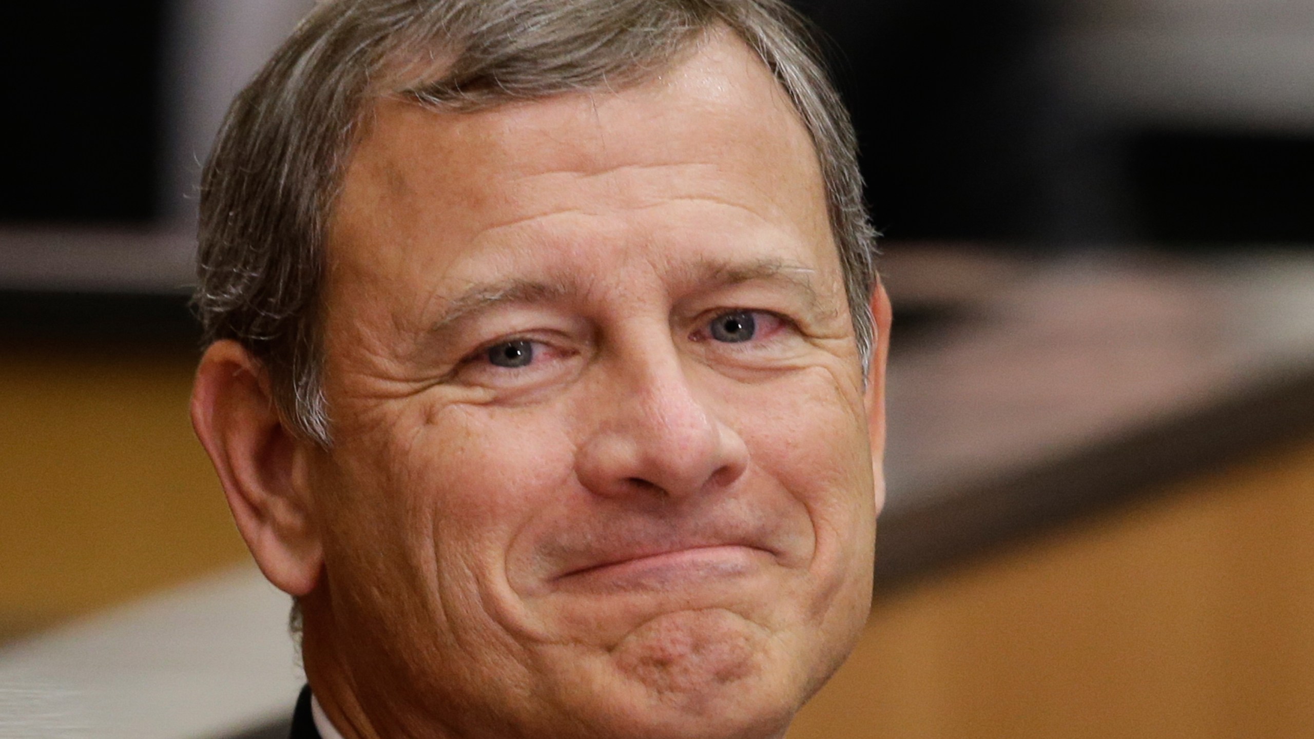 FILE - Supreme Court Chief Justice John Roberts smiles as he is introduced at the University of Nebraska Lincoln, in Lincoln, Neb., Sept. 19, 2014. (AP Photo/Nati Harnik, File)