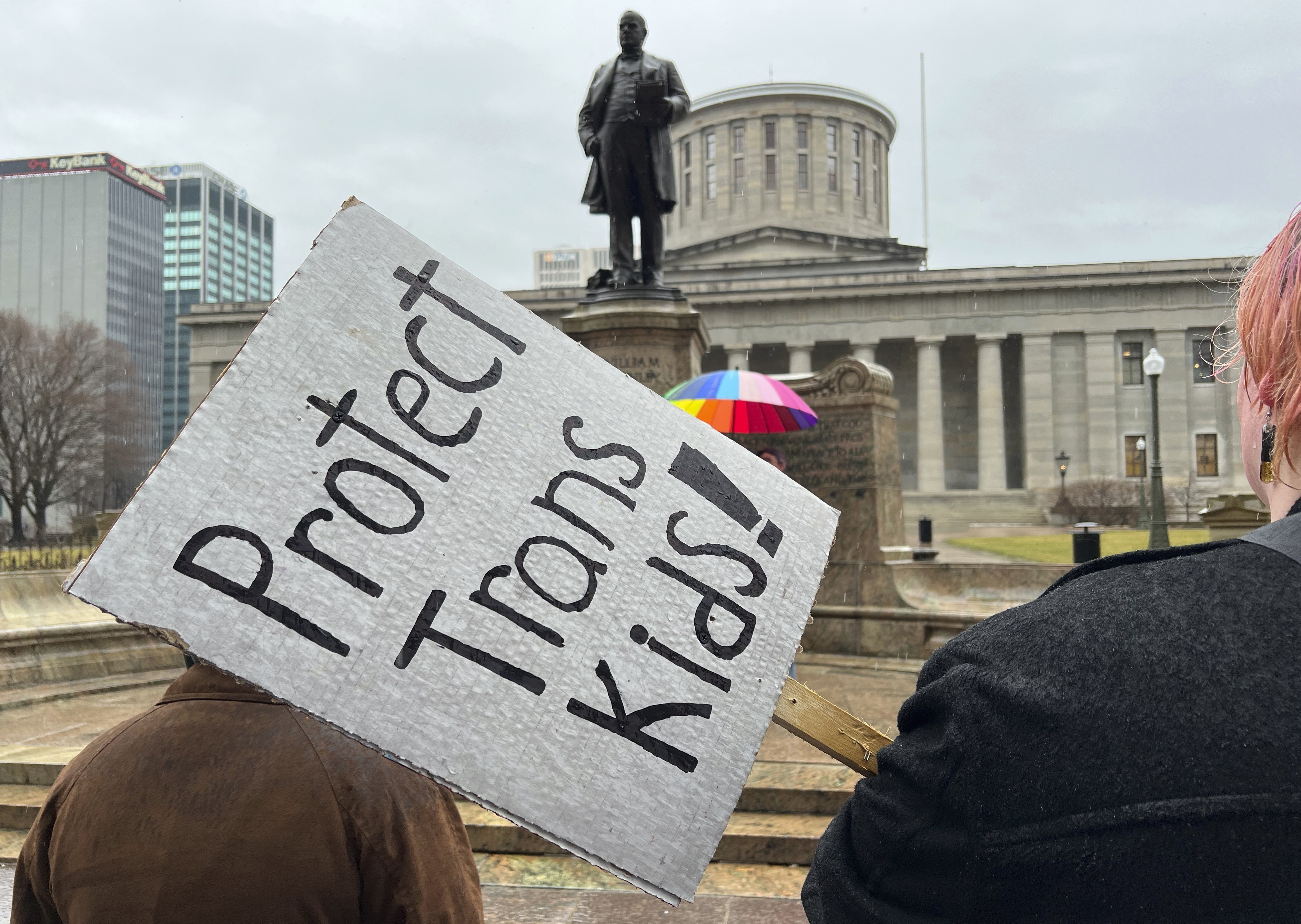 FILE - Protesters advocating for transgender rights and healthcare stand outside of the Ohio Statehouse on Wednesday, Jan. 24, 2024, in Columbus, Ohio. (AP Photo/Patrick Orsagos, File)