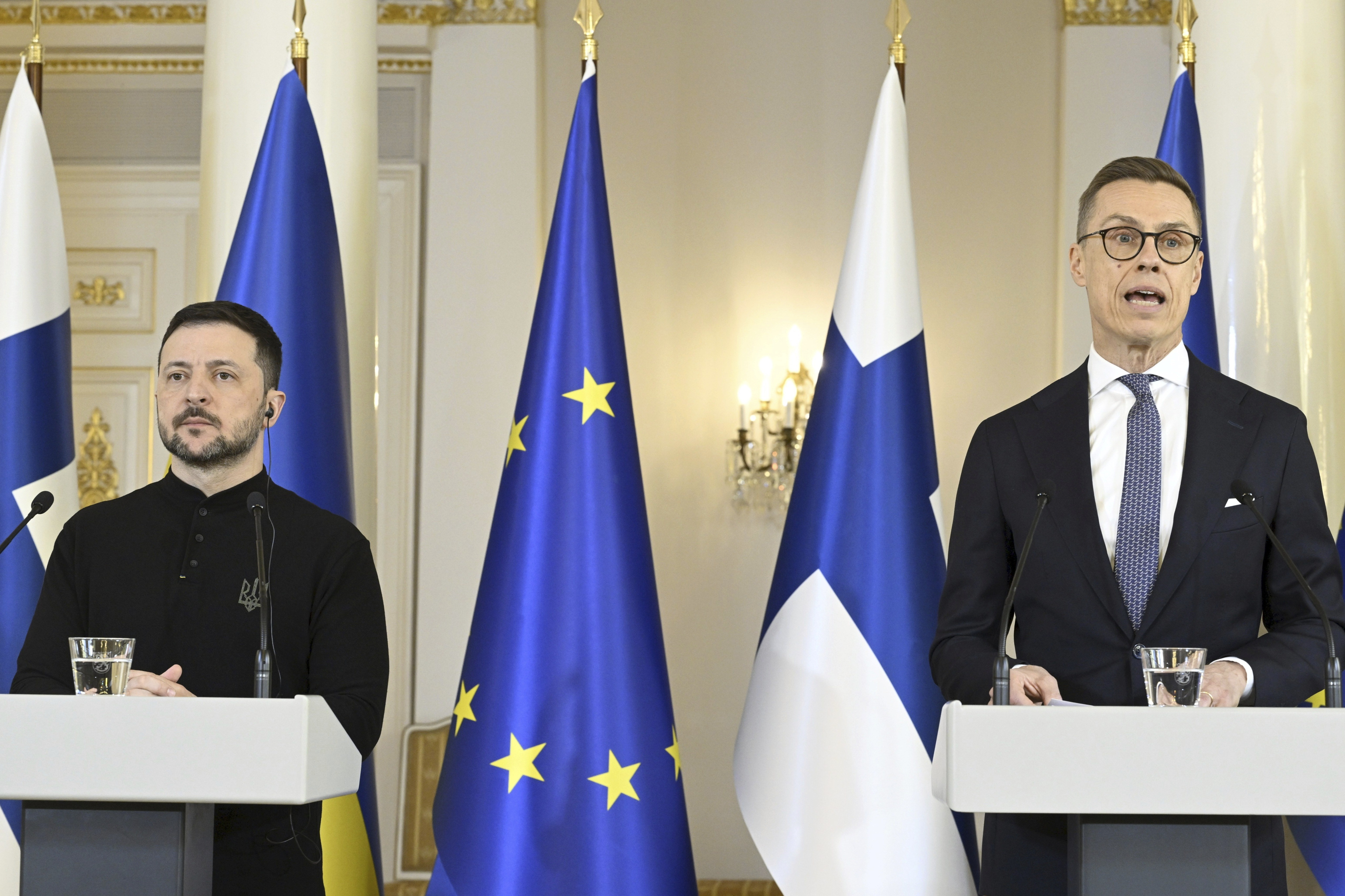 Finland's President Alexander Stubb, right, speaks as he and Ukrainian President Volodymyr Zelenskyy hold a joint press conference, at the Presidential Palace, in Helsinki, Finland, Wednesday, March 19, 2025. (Heikki Saukkomaa/Lehtikuva via AP)