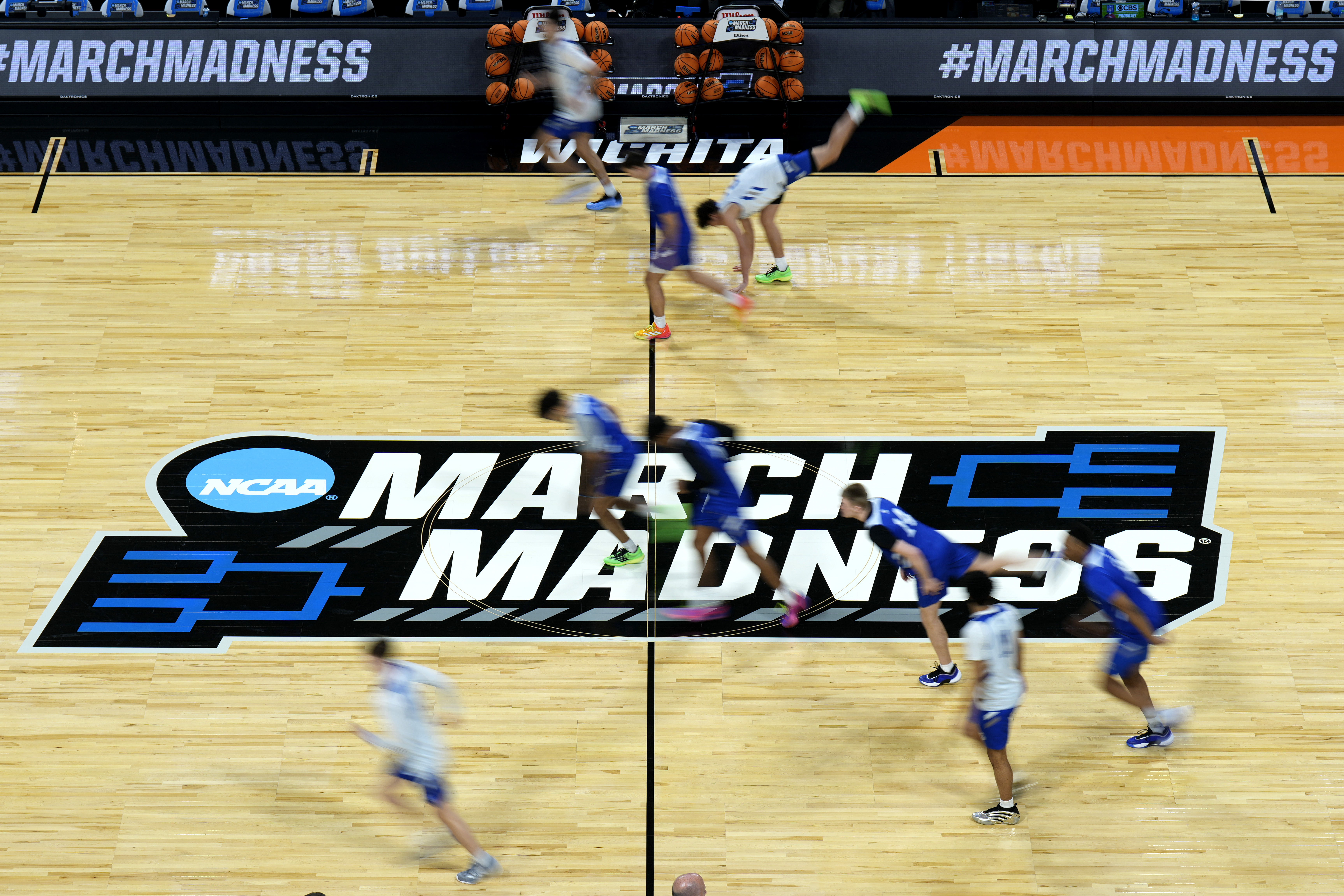 Drake players warm up during practice for the first round of the NCAA college basketball tournament, Wednesday, March 19, 2025, in Wichita, Kan. (AP Photo/Charlie Riedel)