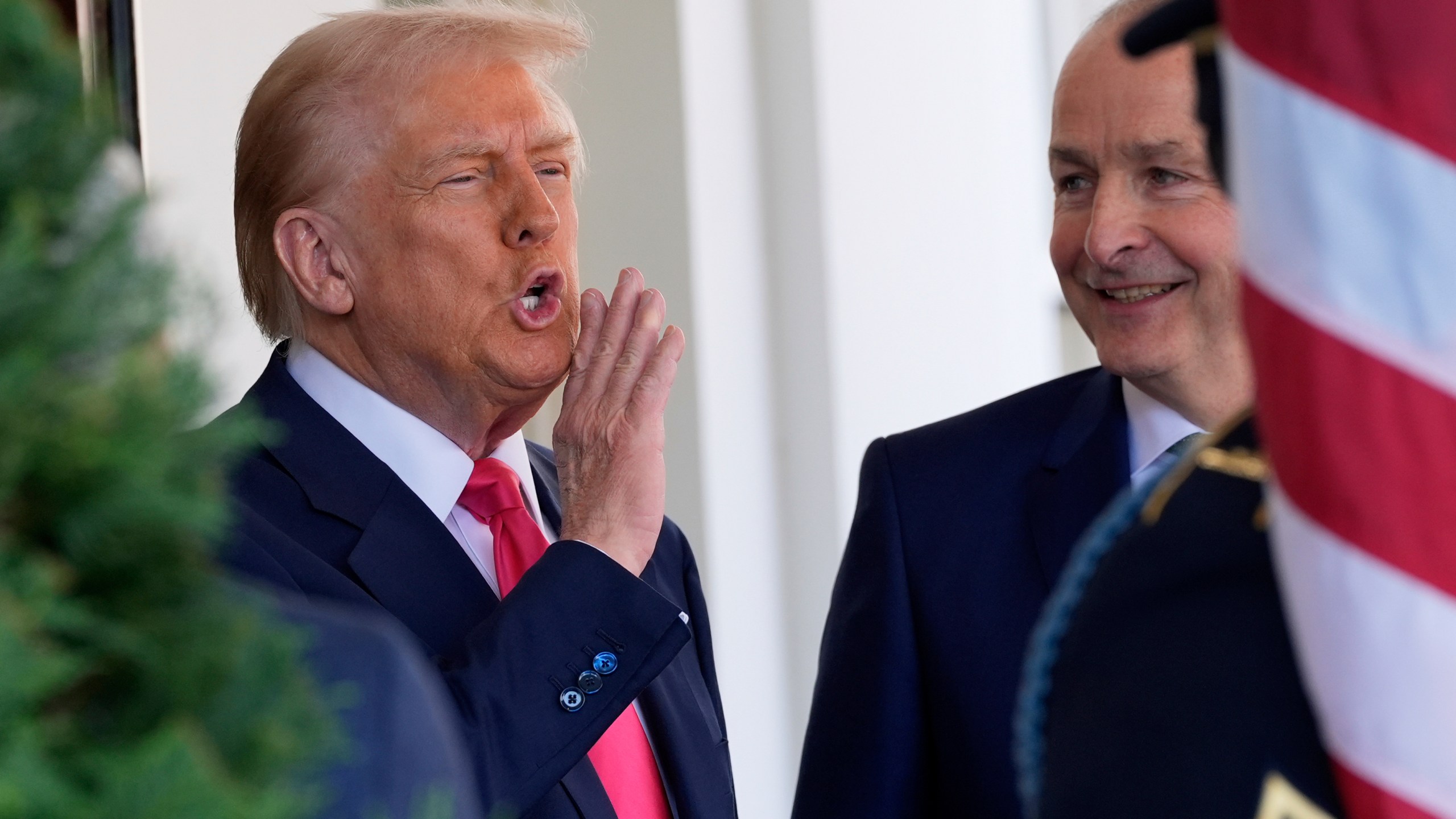 President Donald Trump greets Ireland's Prime Minister Micheál Martin as he arrives at the West Wing of the White House in Washington, Wednesday, March 12, 2025. (AP Photo/Alex Brandon)