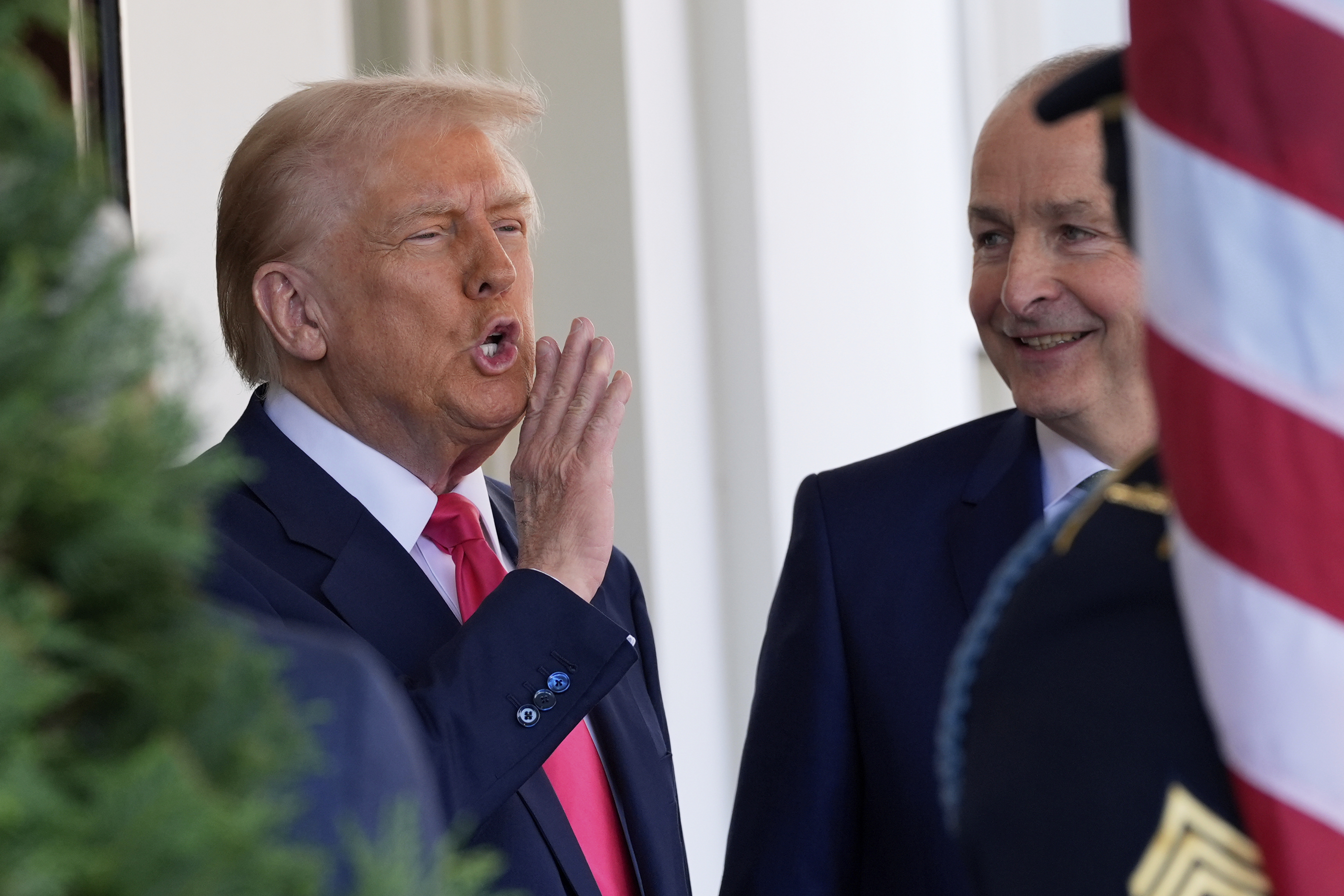 President Donald Trump greets Ireland's Prime Minister Micheál Martin as he arrives at the West Wing of the White House in Washington, Wednesday, March 12, 2025. (AP Photo/Alex Brandon)