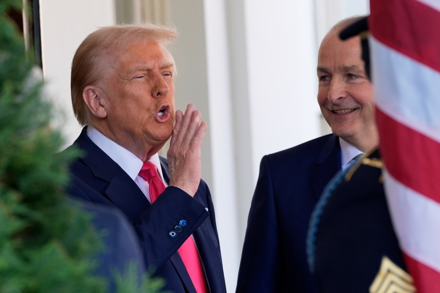 President Donald Trump greets Ireland's Prime Minister Micheál Martin as he arrives at the West Wing of the White House in Washington, Wednesday, March 12, 2025. (AP Photo/Alex Brandon)