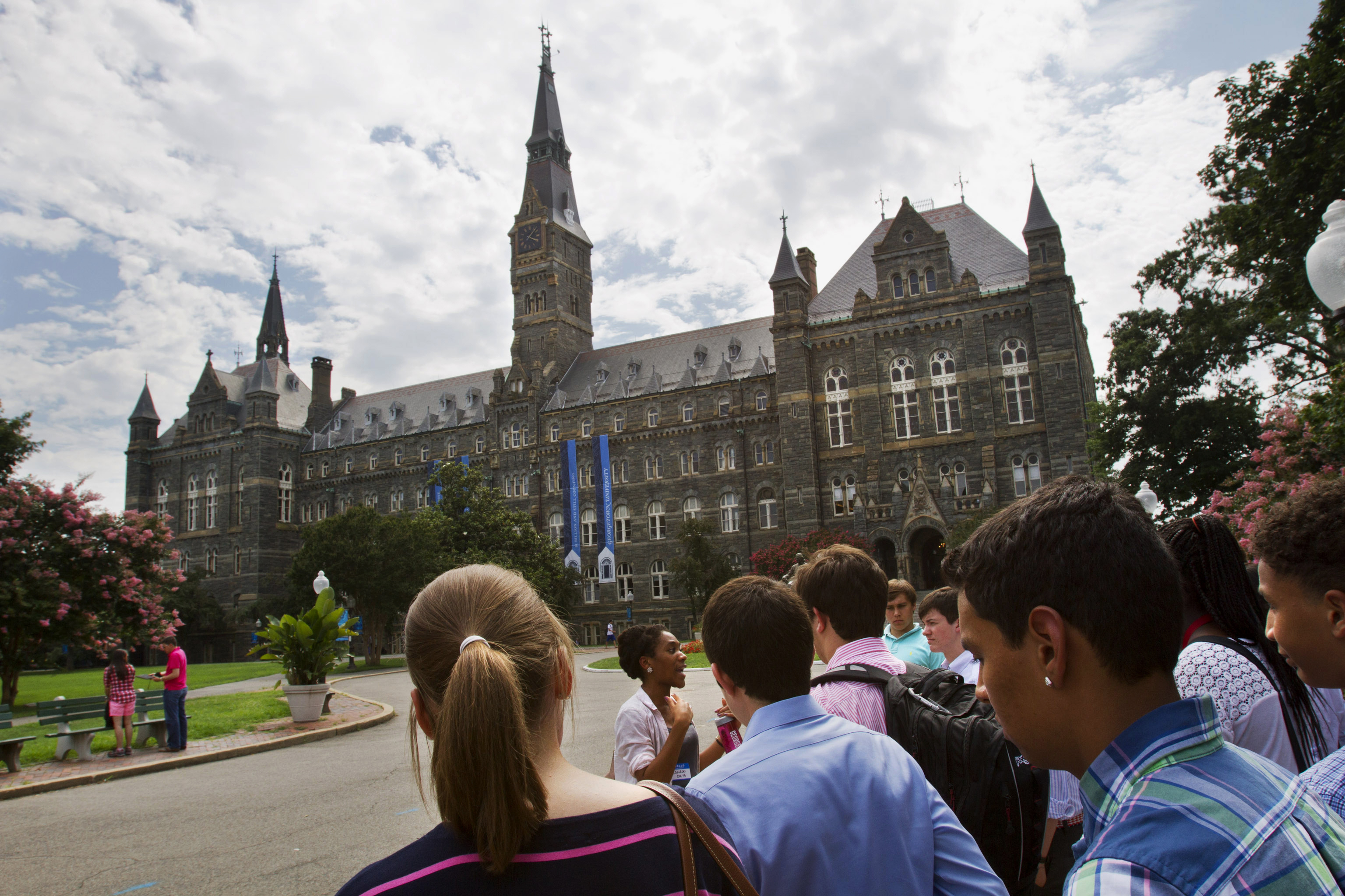 FILE - In this July 10, 2013, file photo, prospective students tour Georgetown University's campus in Washington. (AP Photo/Jacquelyn Martin, File)