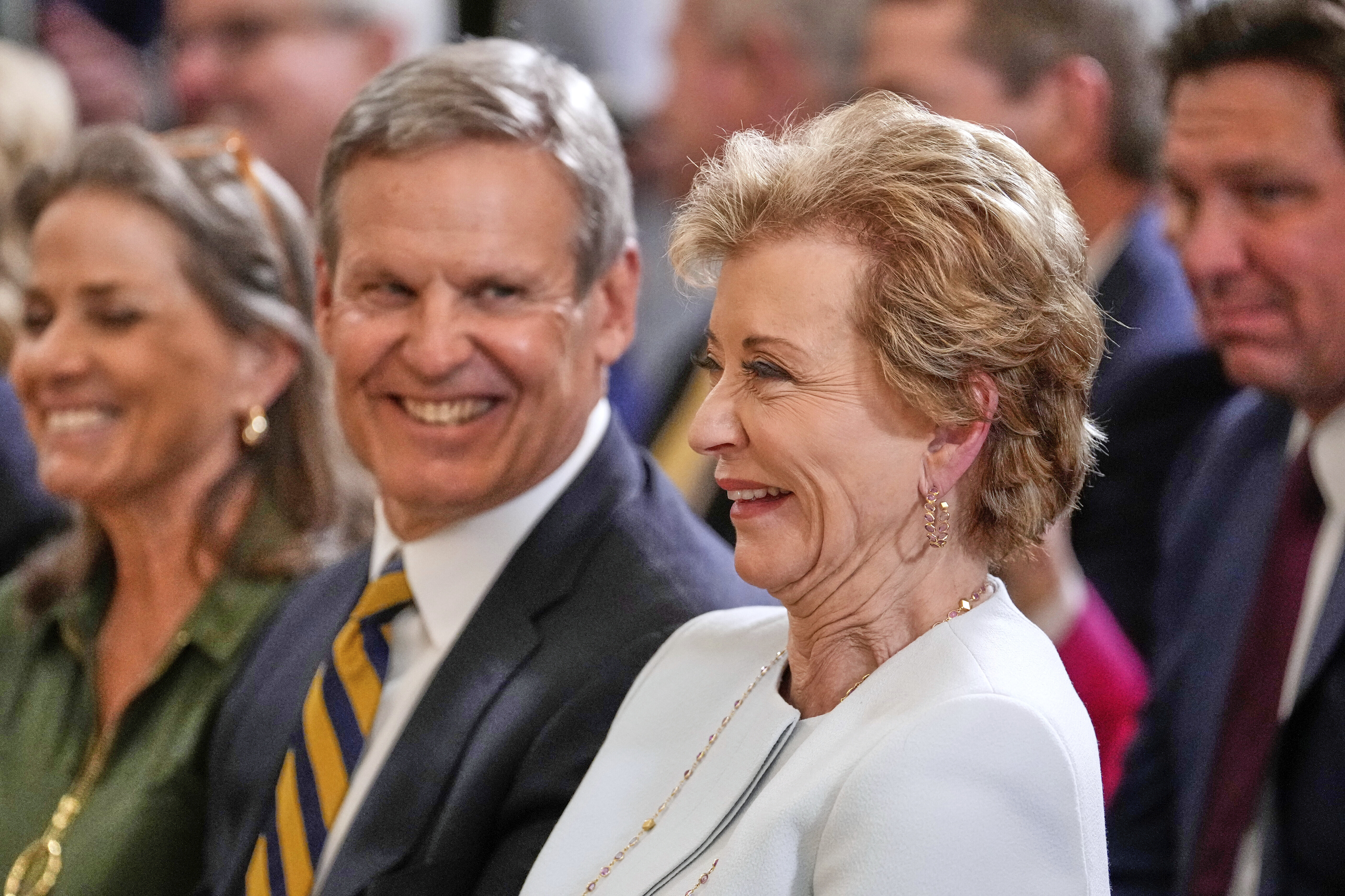 Secretary of Education Linda McMahon listens as President Donald Trump speaks at an education event and executive order signing in the East Room of the White House in Washington, Thursday, March 20, 2025. (AP Photo/Ben Curtis)