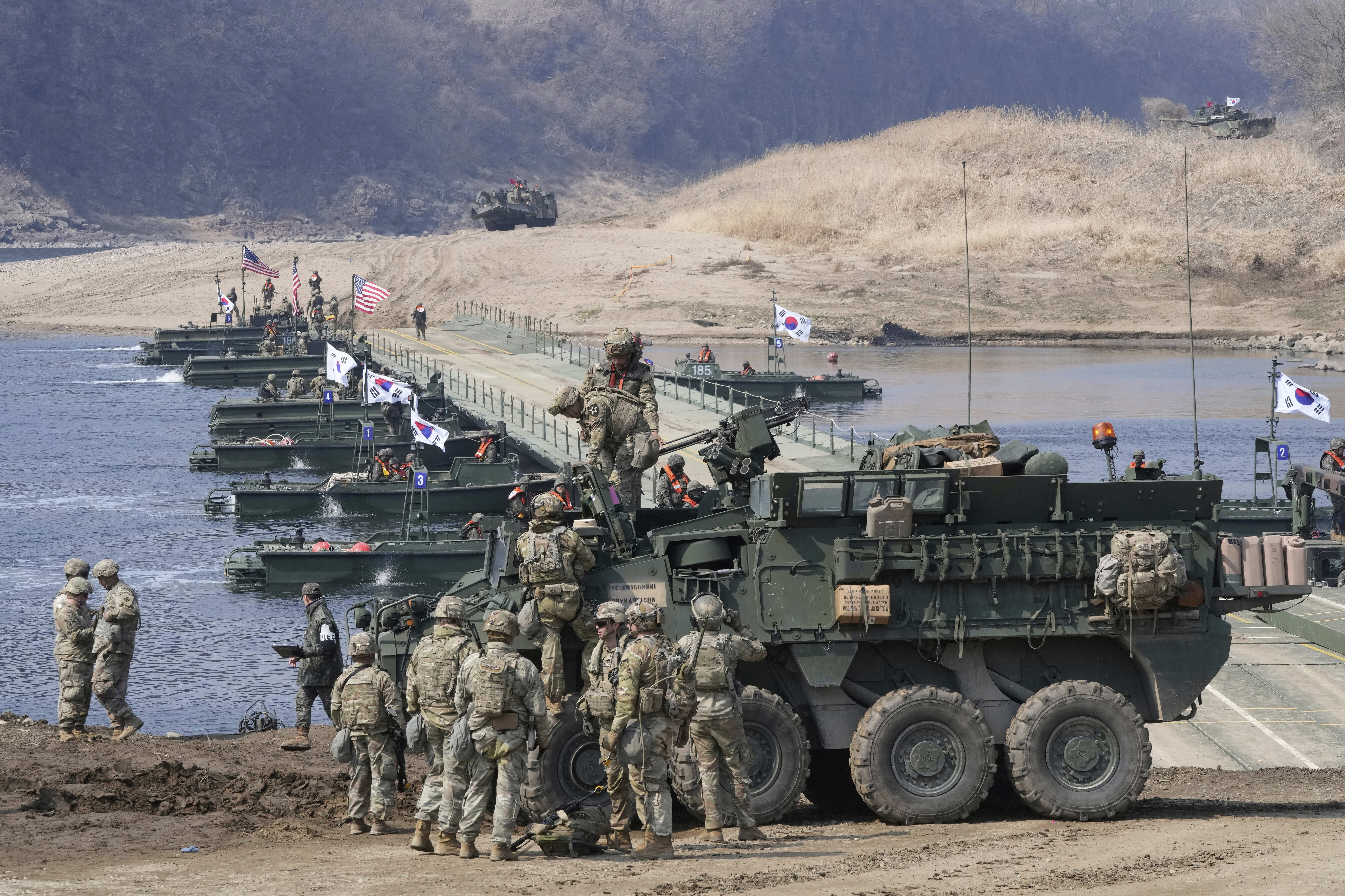 U.S. Army soldiers participate in a joint river-crossing exercise between South Korea and the United States as a part of the Freedom Shield military exercise in Yeoncheon, South Korea, Thursday, March 20, 2025. (AP Photo/Ahn Young-joon)