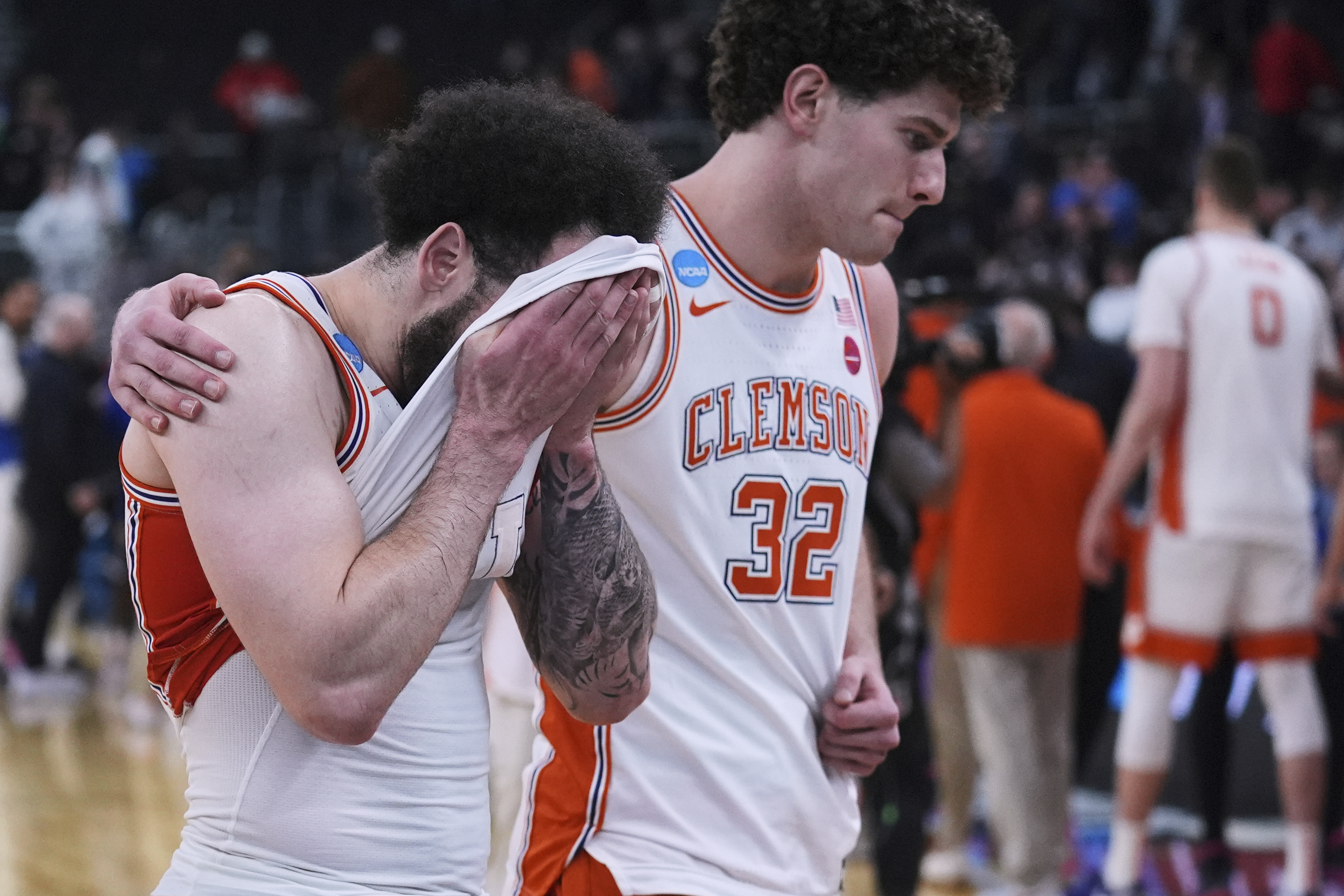 Clemson guard Jaeden Zackery, left, react after a loss to McNeese State in the first round of the NCAA college basketball tournament, Thursday, March 20, 2025, in Providence, R.I. (AP Photo/Charles Krupa)