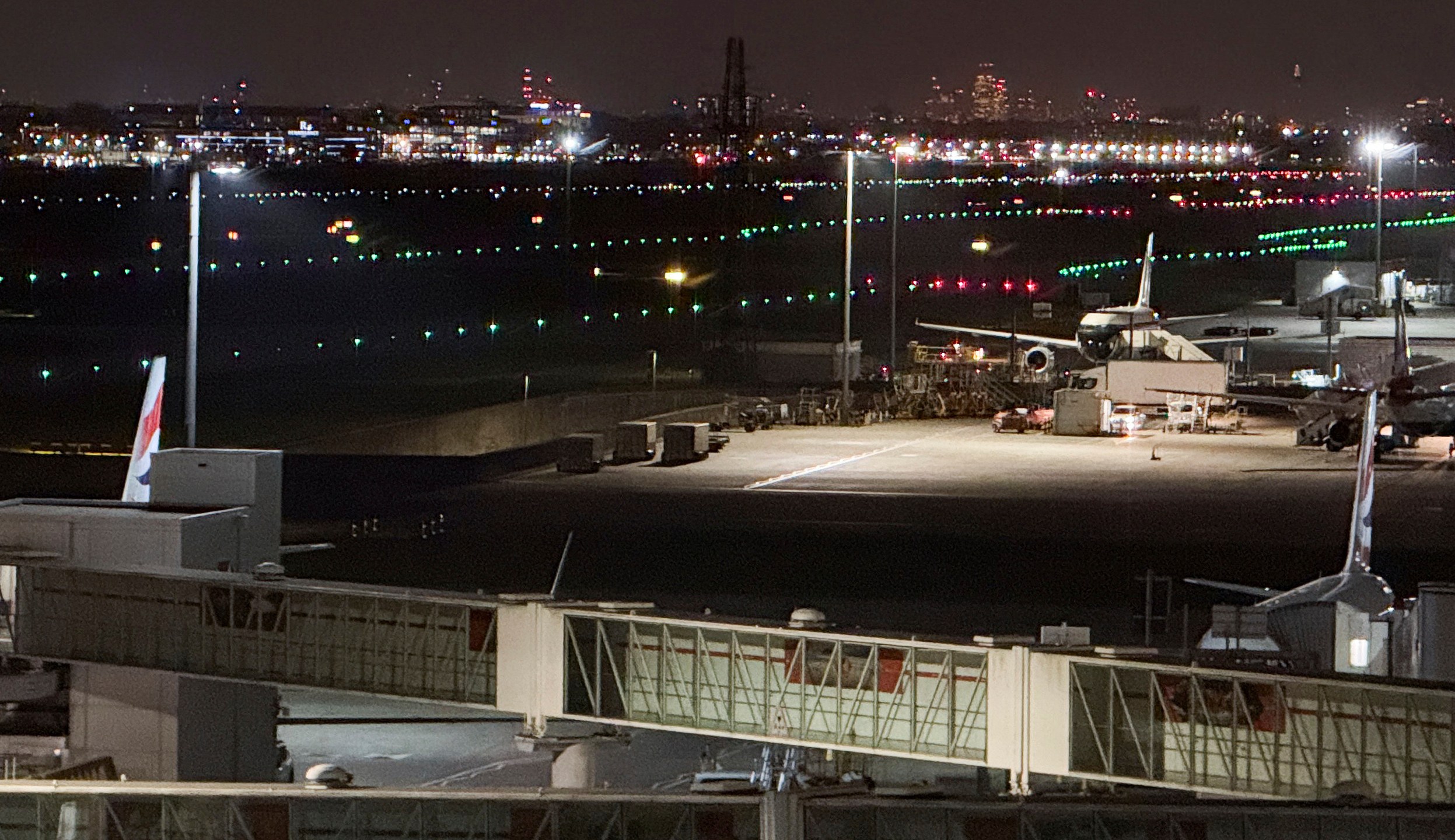 The runway at Heathrow Airport is lit again after a fire at an electrical substation shuttered Europe's busiest air travel hub in London, Friday, March 21, 2025.(AP Photo/Alberto Pezzali)