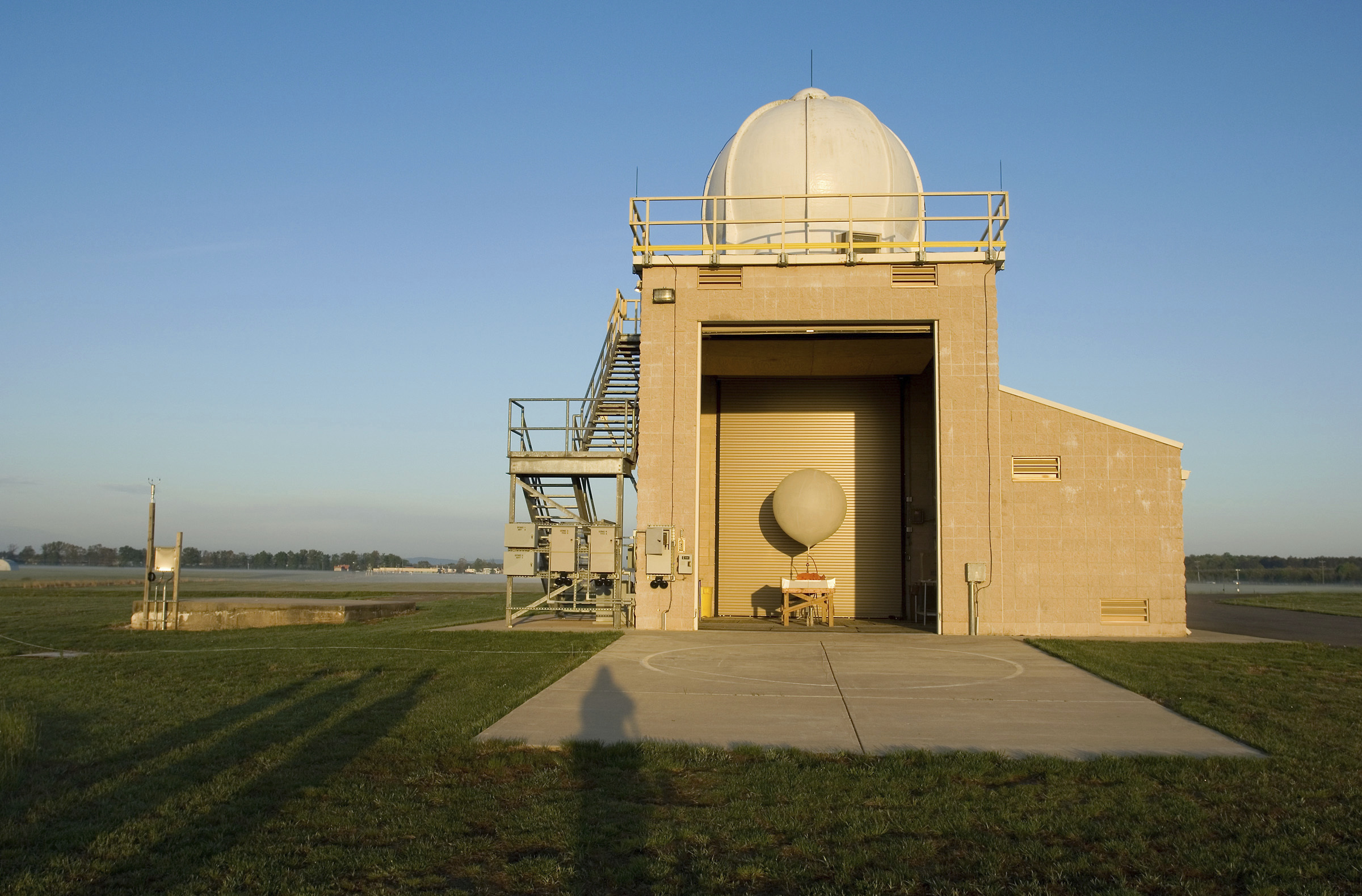 FILE - A National Weather Service weather balloon sits ready for launch in the Upper Air Inflation Building at the National Weather Service, April 27, 2006, in Sterling, Va. (AP Photo/Chris Greenberg, File)