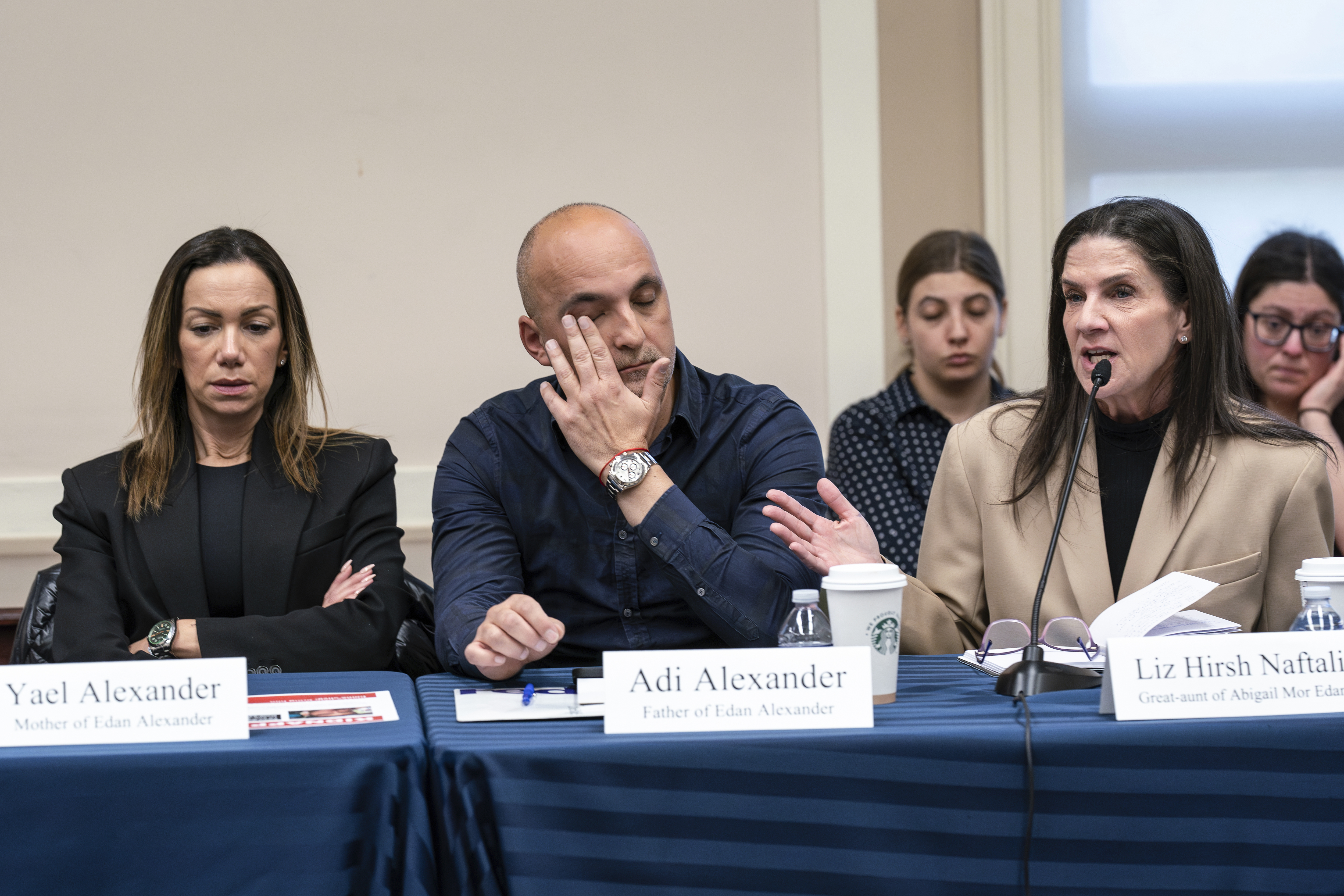 FILE - From left, Yael and Adi Alexander, parents of Eden Alexander, who was abducted and brought to Gaza on Oct. 7, 2023, listen to Liz Hirsh Naftali, great aunt of Abigail More Edan, as families and victims of the Hamas attacks meet with the House Foreign Affairs Committee, at the Capitol in Washington, Nov. 29. (AP Photo/J. Scott Applewhite, File)