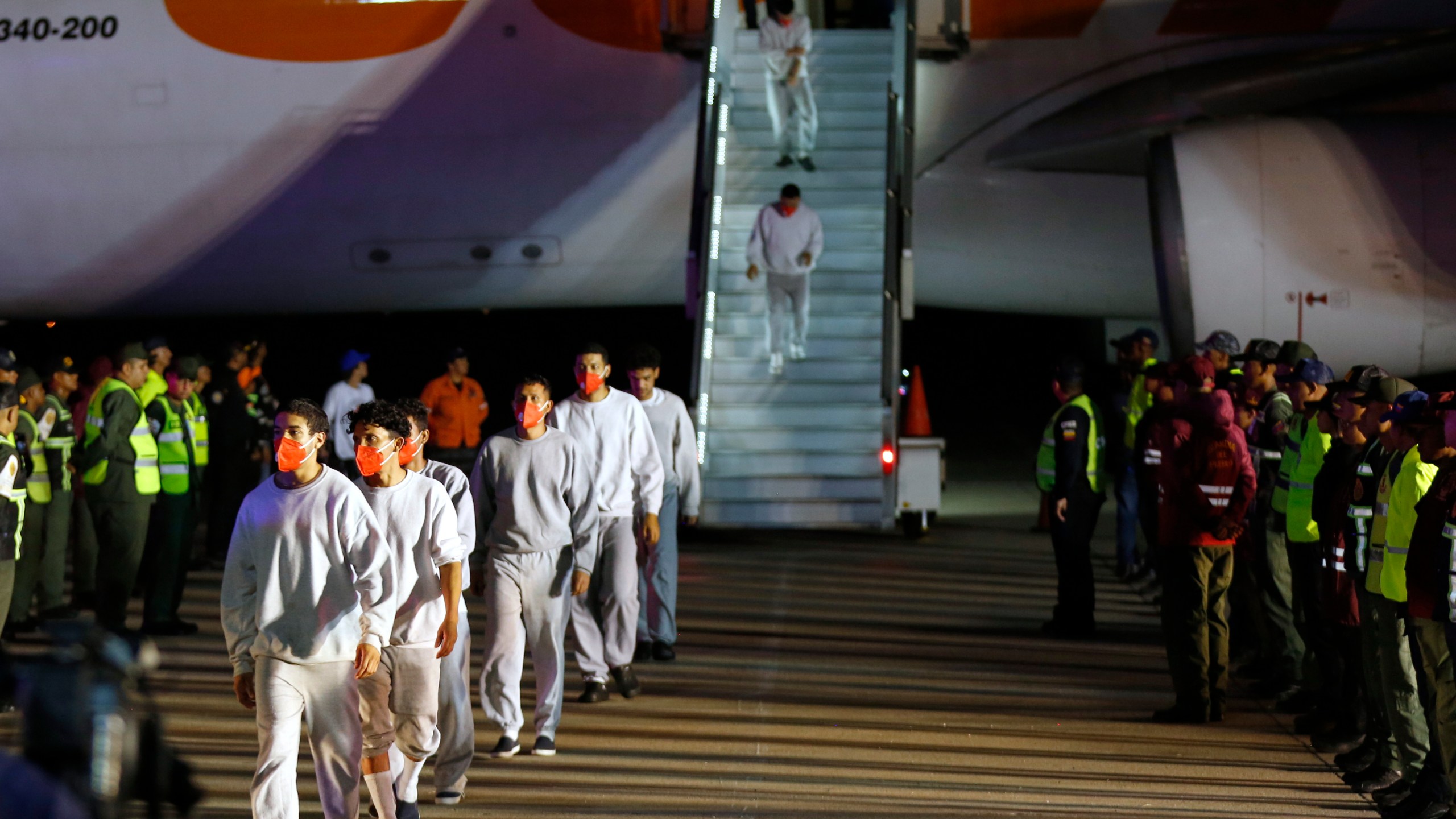 FILE - Venezuelan migrants deported from the United States deplane at the Simon Bolivar International Airport in Maiquetia, Venezuela, Feb. 20, 2025. (AP Photo/Cristian Hernandez, File)