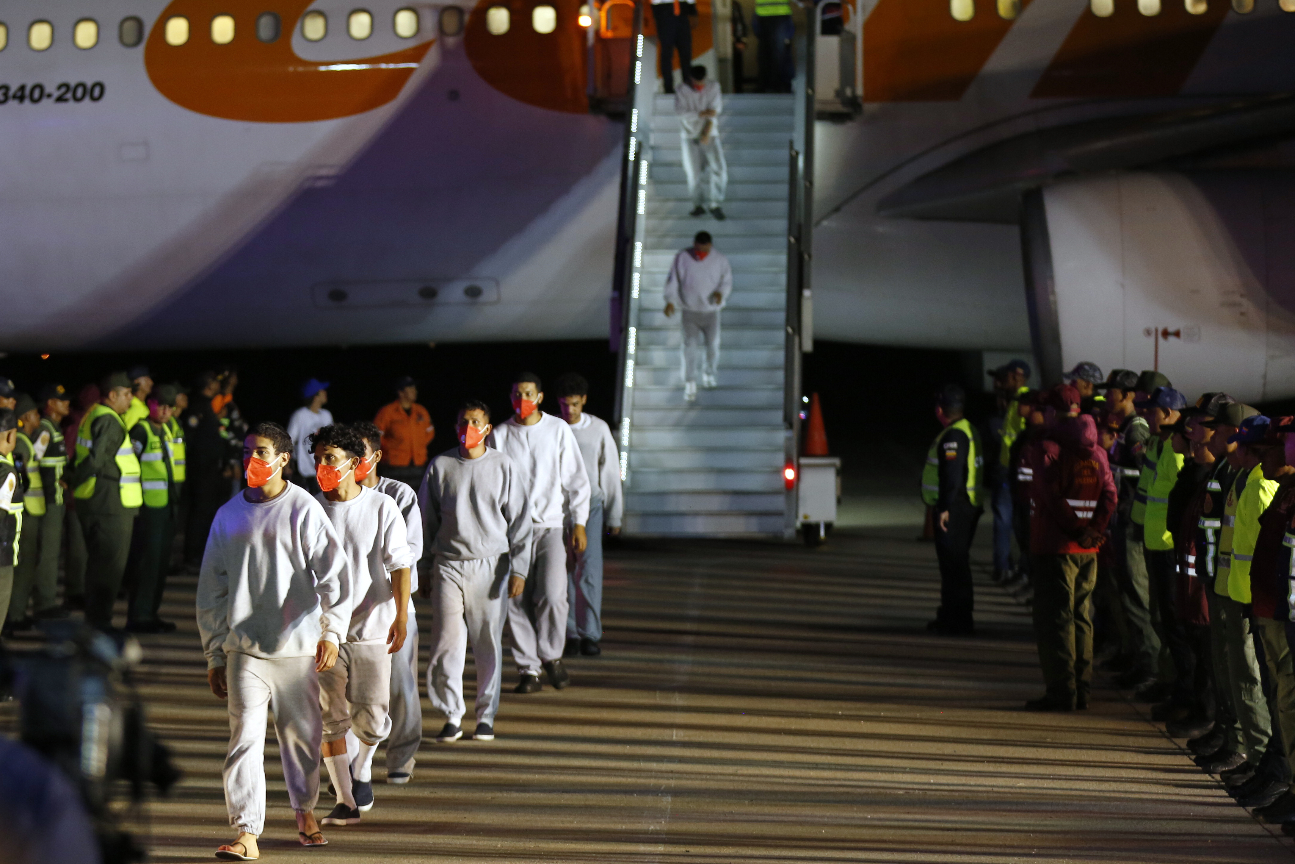 FILE - Venezuelan migrants deported from the United States deplane at the Simon Bolivar International Airport in Maiquetia, Venezuela, Feb. 20, 2025. (AP Photo/Cristian Hernandez, File)